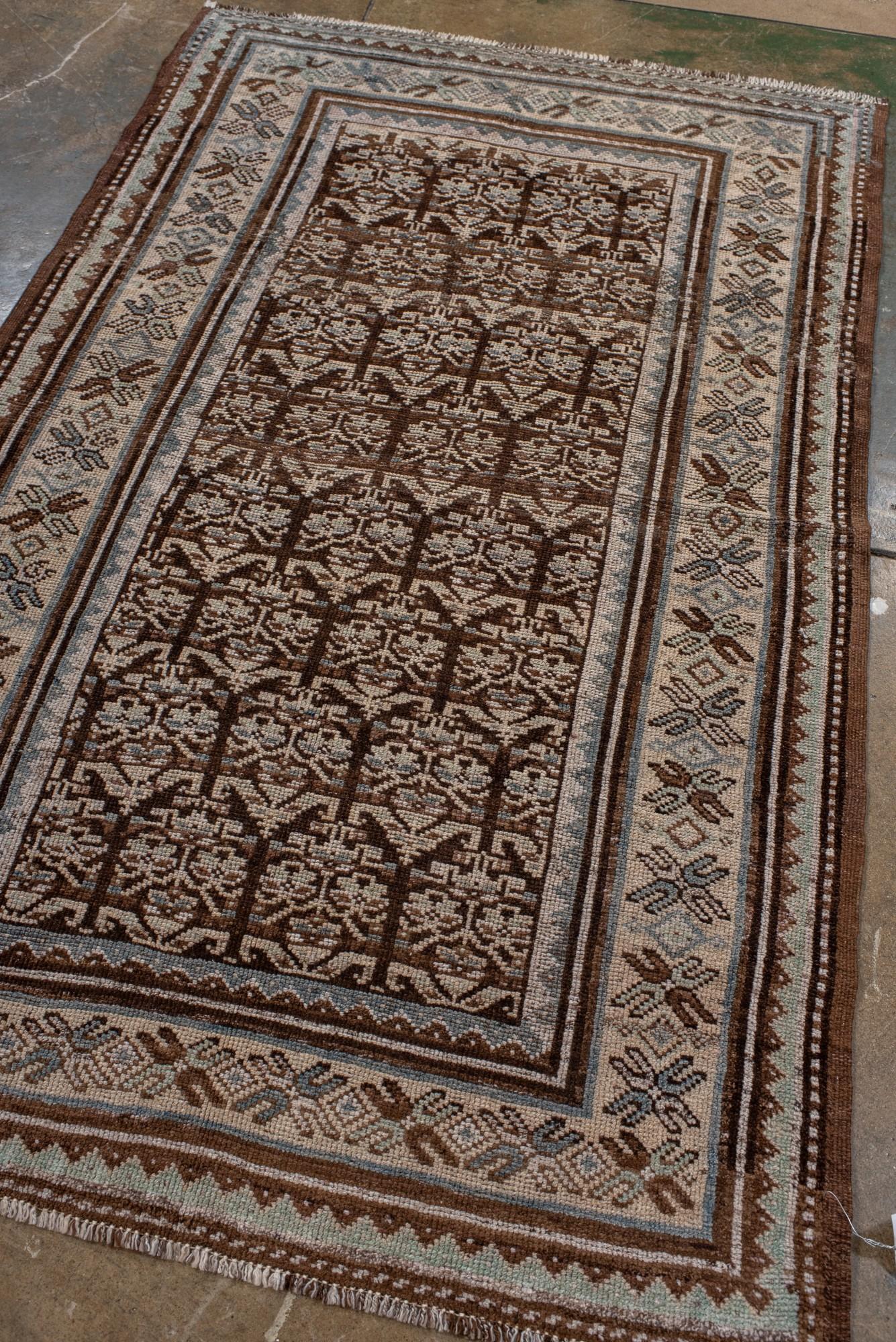 Persian Antique Kurdish Rug with Repeating Tree Motif in Earth Tones For Sale