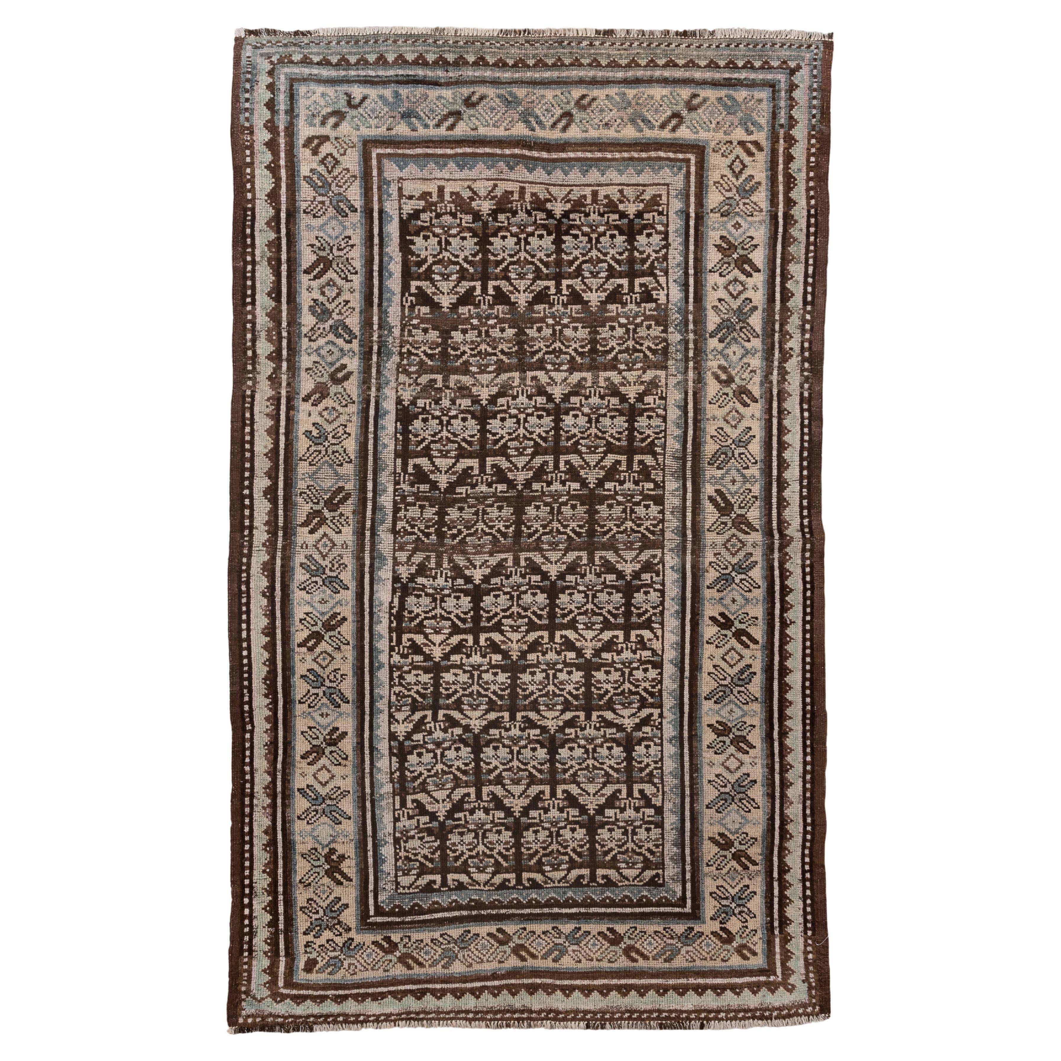 Antique Kurdish Rug with Repeating Tree Motif in Earth Tones For Sale
