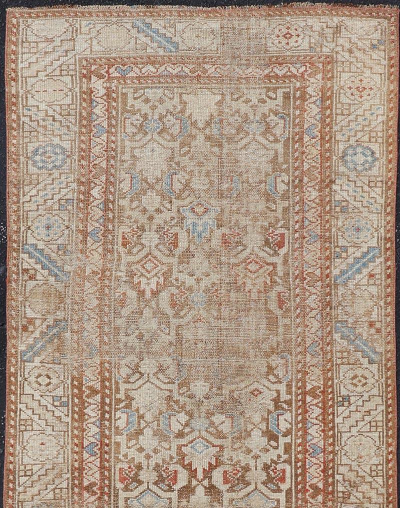 20th Century Antique Kurdish Runner in Soft Tones in Wool with All-Over Tribal Design For Sale