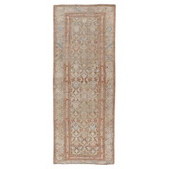 Antique Kurdish Runner in Soft Tones in Wool with All-Over Tribal Design