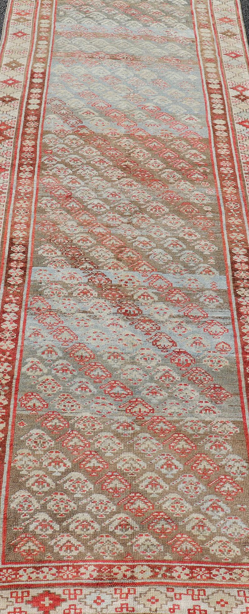 Hand-Knotted Antique Kurdish Runner in Soft Tones in Wool with Sub-Geometric Paisley Design For Sale