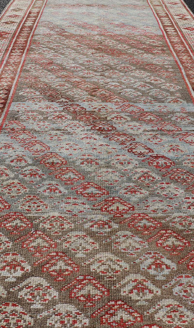 Antique Kurdish Runner in Soft Tones in Wool with Sub-Geometric Paisley Design In Good Condition For Sale In Atlanta, GA