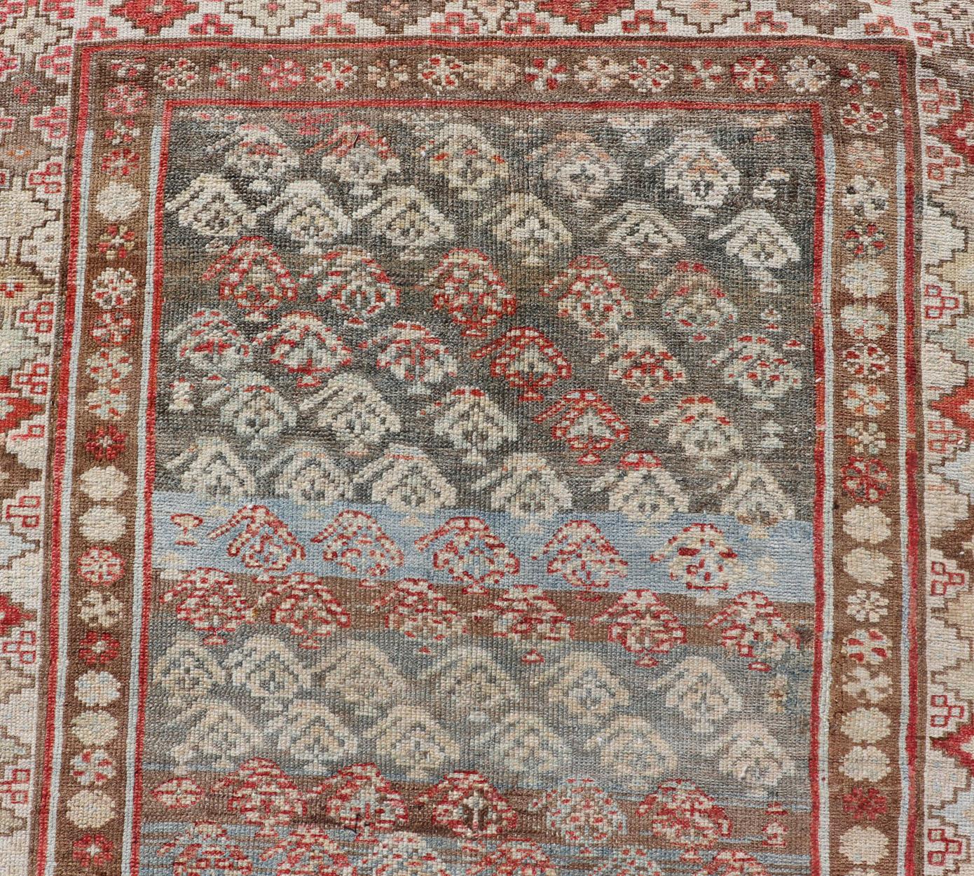 Antique Kurdish Runner in Soft Tones in Wool with Sub-Geometric Paisley Design For Sale 1