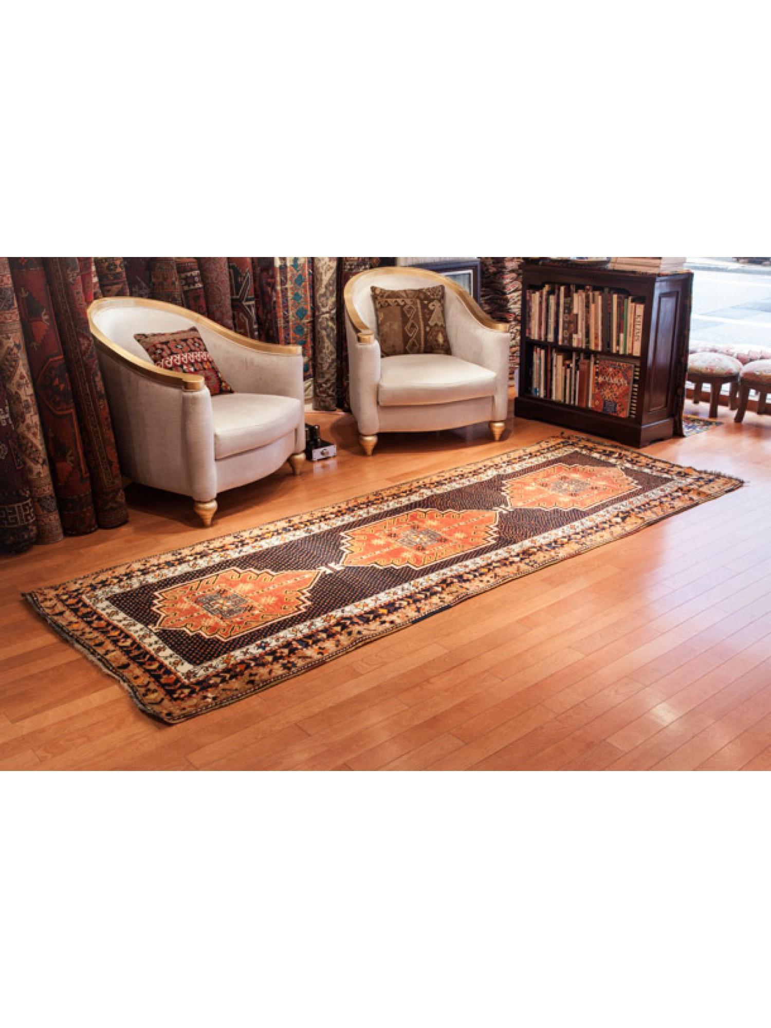 This is an Antique Kurdish Runner Rug from the Eastern Anatolia region with a rare and beautiful color composition.

Anatolian Kurdish rugs are handwoven rugs that originate from the Anatolian regions of Turkey and are associated with the Kurdish