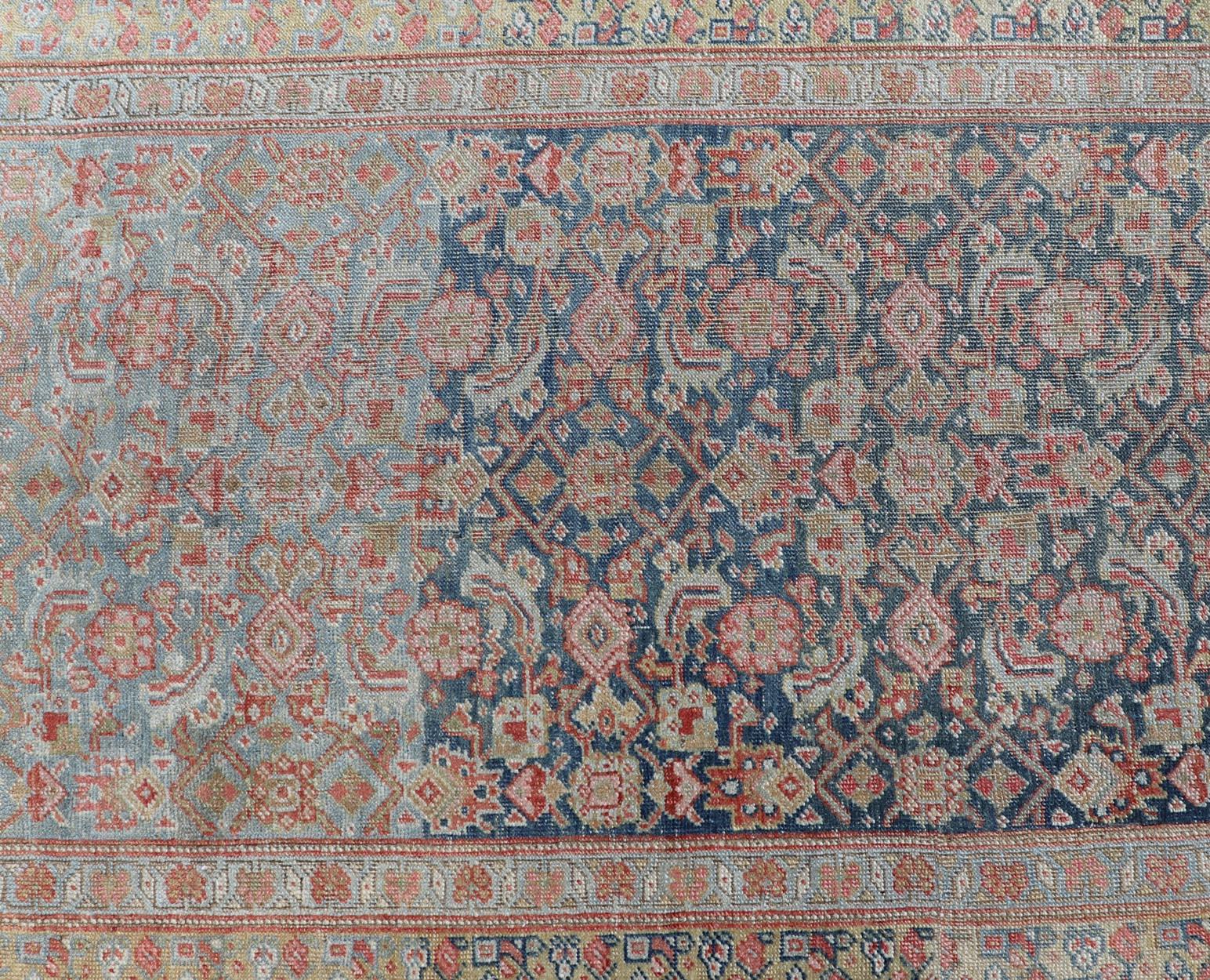 Antique Kurdish runner with All Over Herati Design in variegated Blue & Yellow Green. Keivan Woven Arts: rug R20-1201 Country of Origin: Iran Type: Kurdish Circa: 1920

Measures: 3'2 x 15'0 

This antique Persian Kurdish runner has been