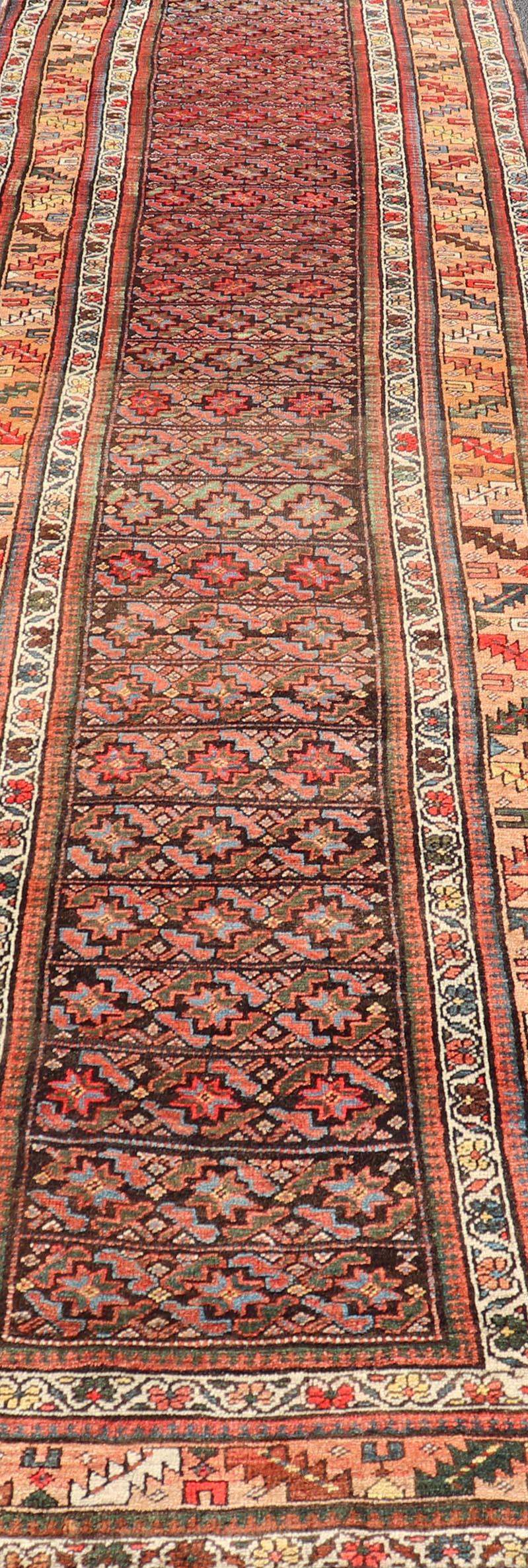 Tribal Antique Kurdish Runner with All-Over Geometric Design on a Blue Background For Sale