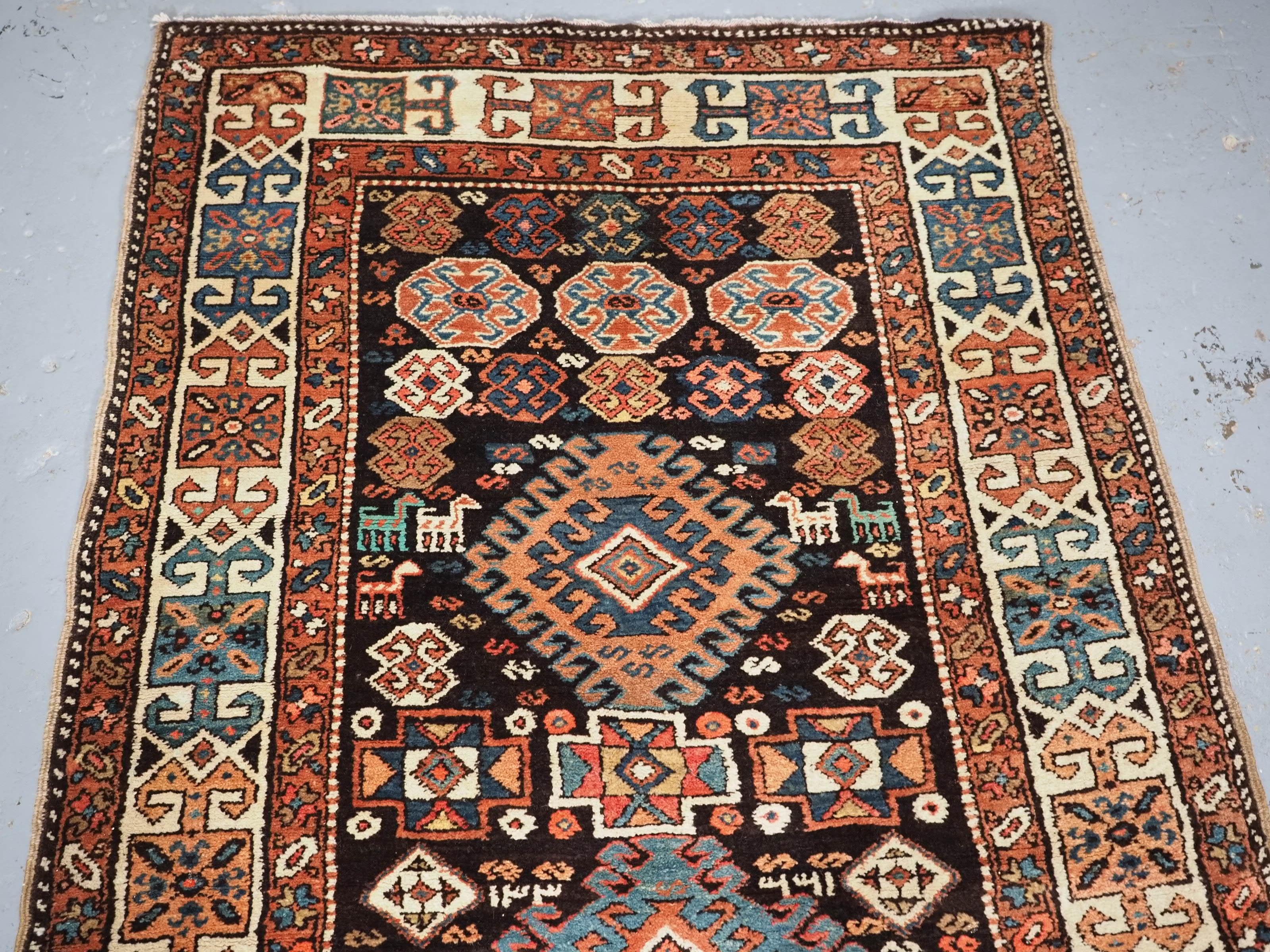 
Size: 12ft 2in x 3ft 8in (370 x 113cm).

Antique Kurdish runner with latch hook medallion design.

Circa 1890.

An excellent Kurdish runner with interesting design on a dark indigo blue ground. The runner is beautifully drawn with many interesting