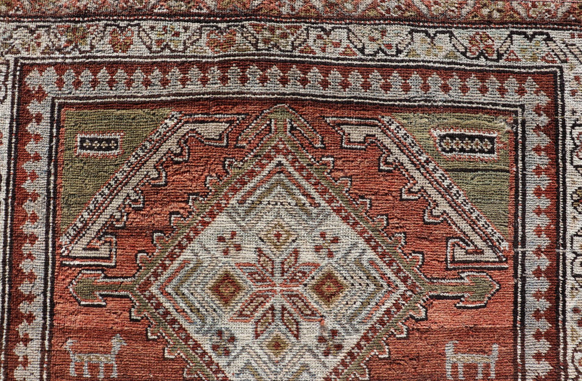 Antique Kurdish Runner with Rusty Red Background and Medallions Tribal Motifs For Sale 2