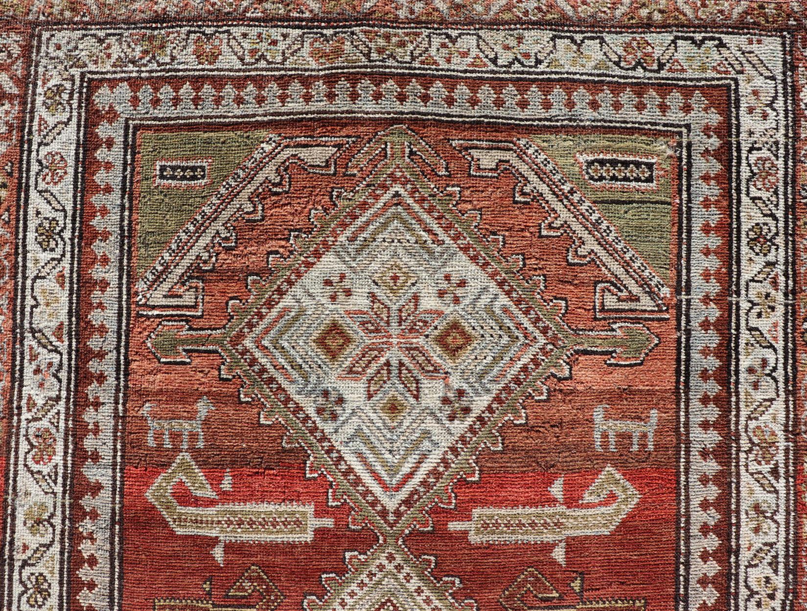 Antique Kurdish Runner with Rusty Red Background and Medallions Tribal Motifs For Sale 3