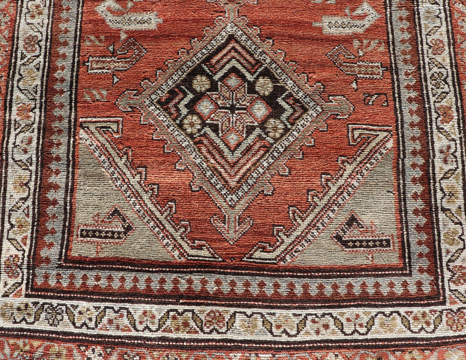 Antique Kurdish Runner with Rusty Red Background and Medallions Tribal Motifs For Sale 4