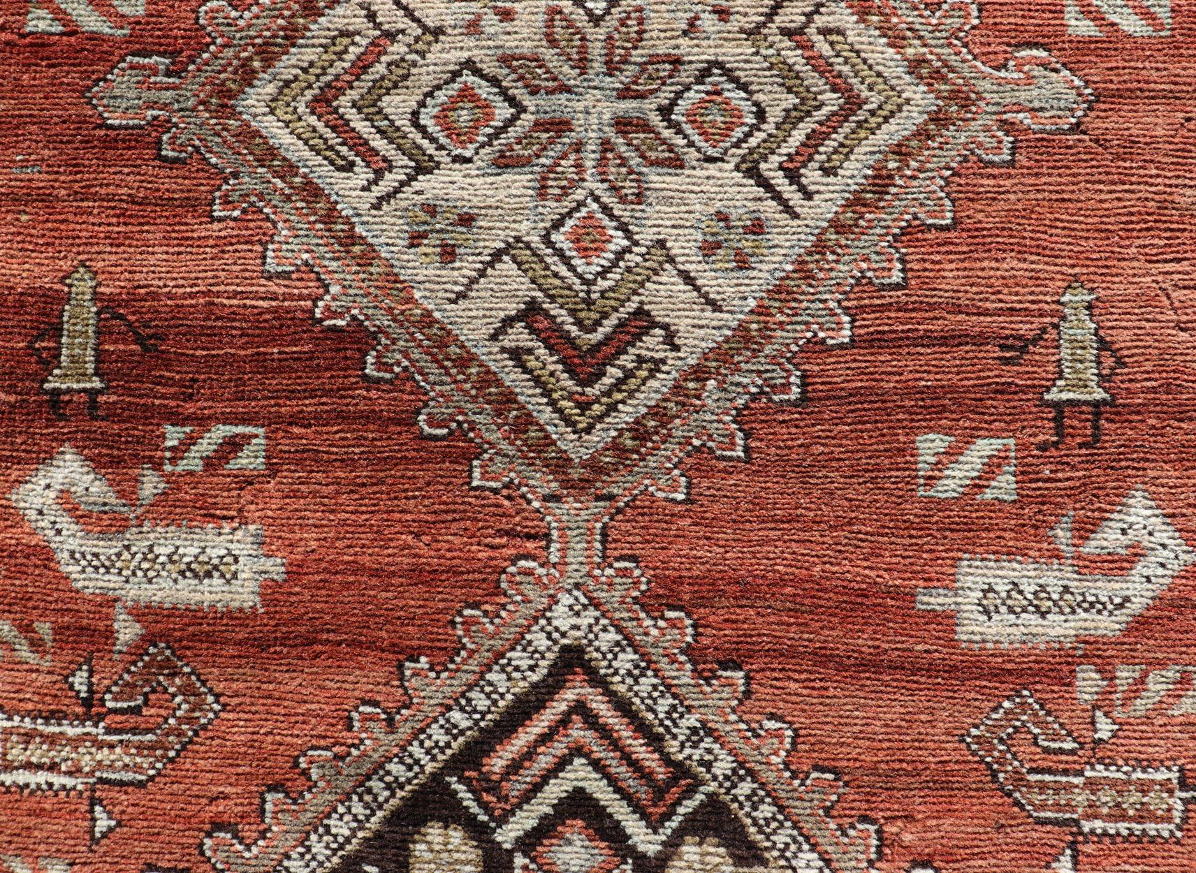 Antique Kurdish Runner with Rusty Red Background and Medallions Tribal Motifs For Sale 5