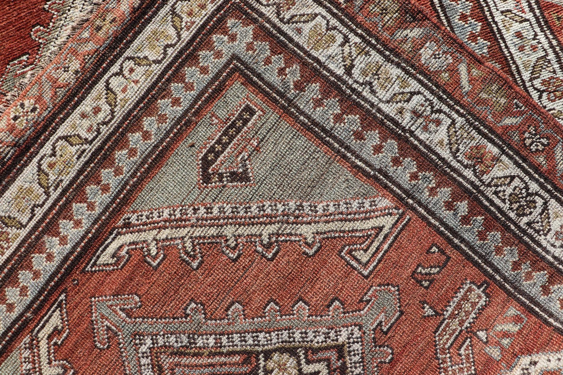 Antique Kurdish Runner with Rusty Red Background and Medallions Tribal Motifs For Sale 6