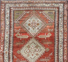 Antique Kurdish Runner with Rusty Red Background and Medallions Tribal Motifs