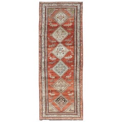 Antique Kurdish Runner with Rusty Red Background and Medallions Tribal Motifs