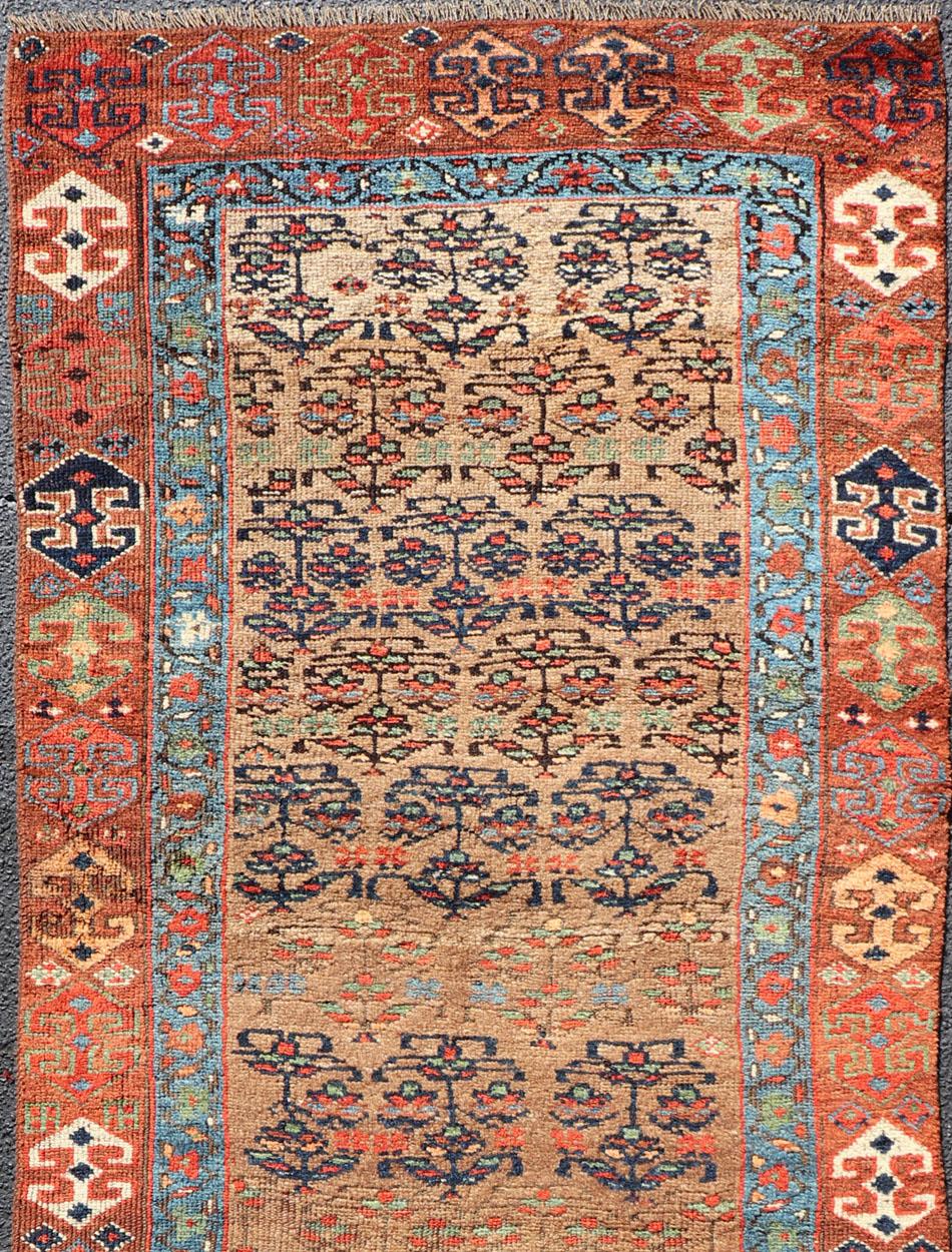 Geometric design antique Kurdish runner, rug / 1912-123. Kurdish rug

This antique Kurdish runner piece features an geometric pattern, with colors ranging from soft rusty red, gorgeous blues, pale green, yellow, cream and chocolate brown