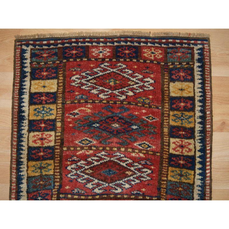Antique Kurdish yastik with excellent colour and traditional design.

Yastik are small piled rugs that were used as pillows or back rests.

The yastik is well drawn with good colour including a soft yellow. The border design is of particular