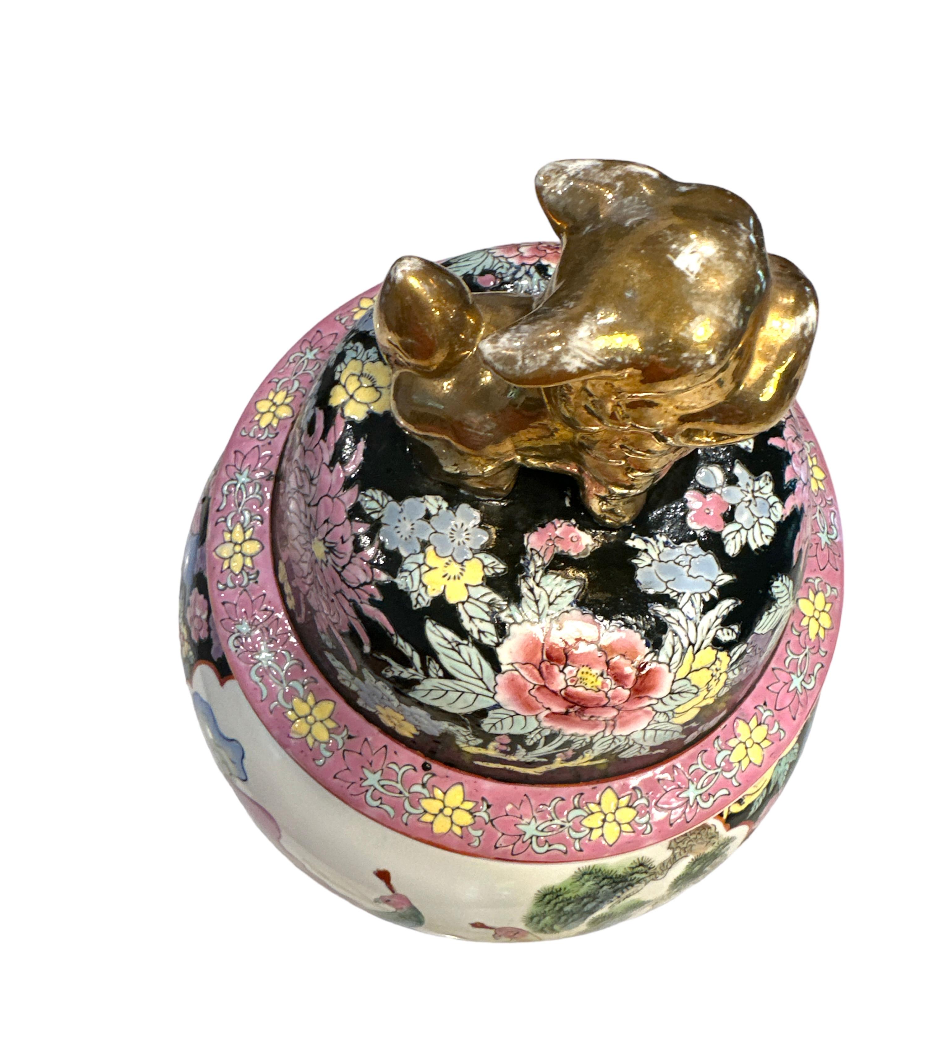 Antique Kutani Maison ginger jar.This is quite the statement piece, it is delicatly painted with beautiful pastel colors of peacocks, floral arrangement surround the figures, the colors are soft yet vivid and the Foo dog on the lid is holding a