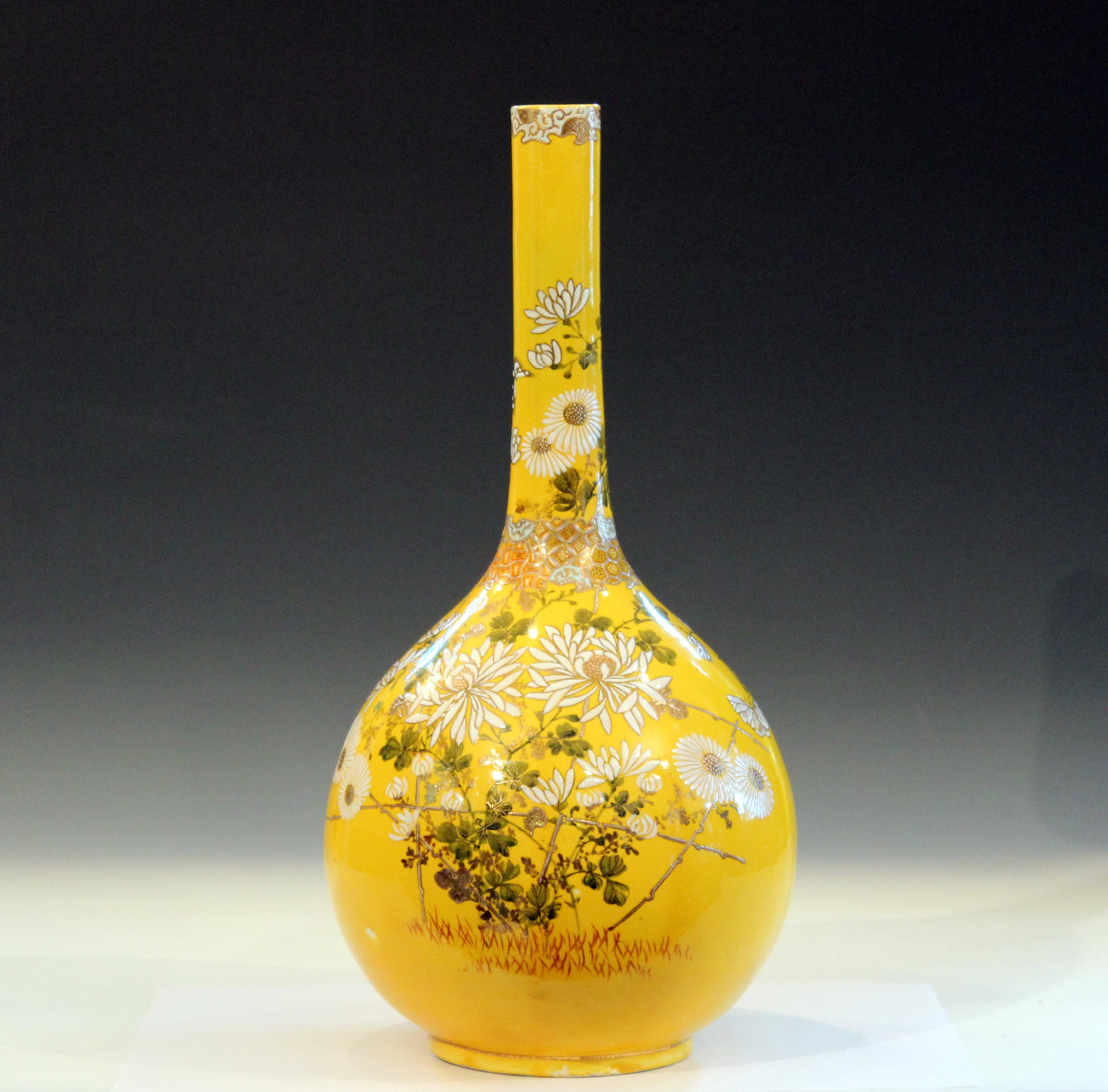 Antique Kyoto Satsuma pottery vase, attributed to the Kinkozan Pottery, with brightly enameled flowers and butterflies against an atomic yellow ground, circa 1910. Measures: 18
