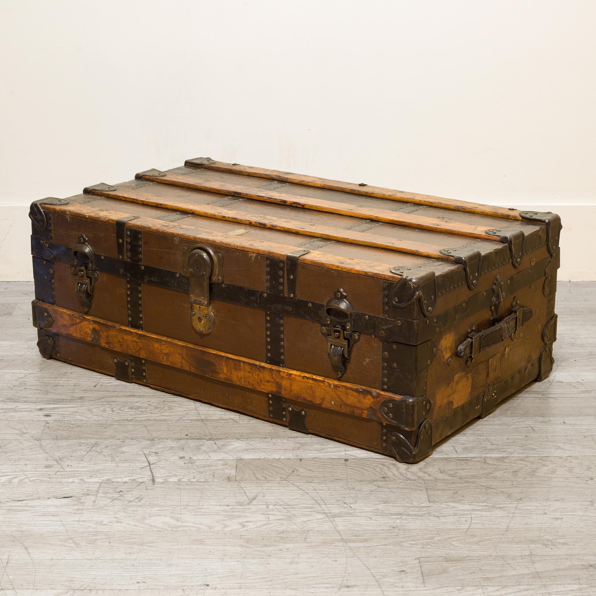 About

An antique wood and steel cabin trunk with metal locks, leather handles and the original brass label by L. Goldsmith and Son Company. This piece has been finished in an oil and wax finish and is in good condition with appropriate patina for