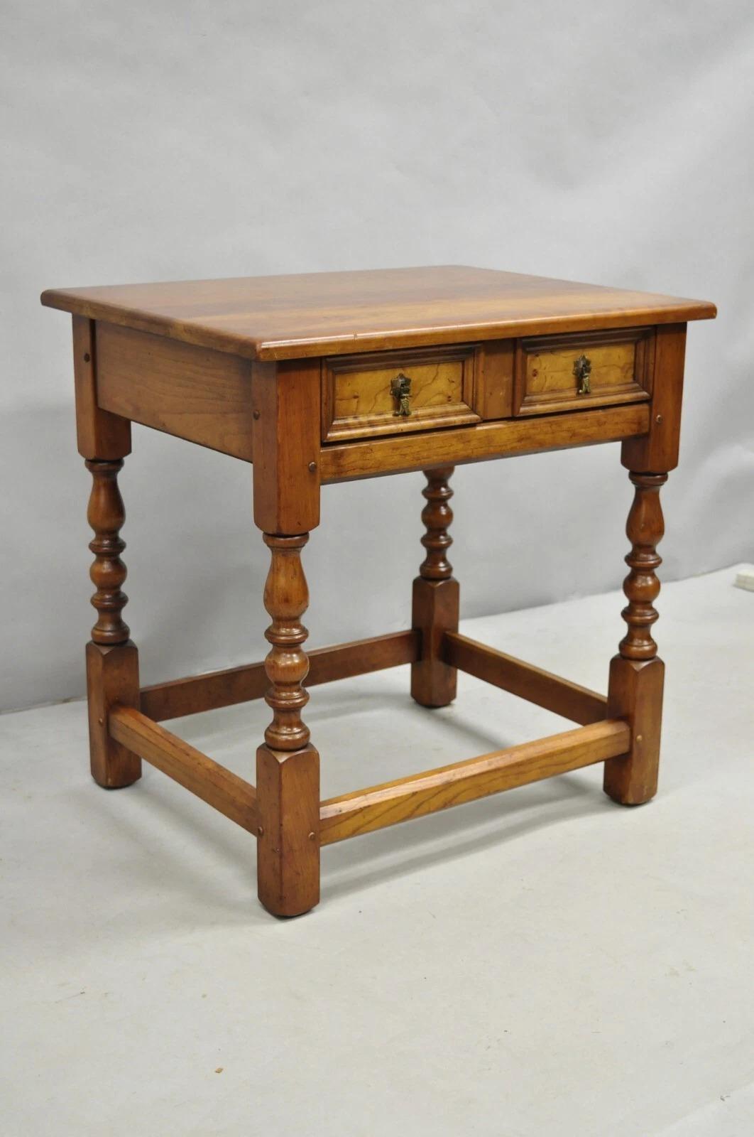 Please message us with your zip code to request a more reasonable domestic U.S. shipping quote.

Antique L & J G Leopold Stickley Jacobean Cherry Wood One Drawer End Side Table. Circa Mid 20th Century. Measurements: 25
