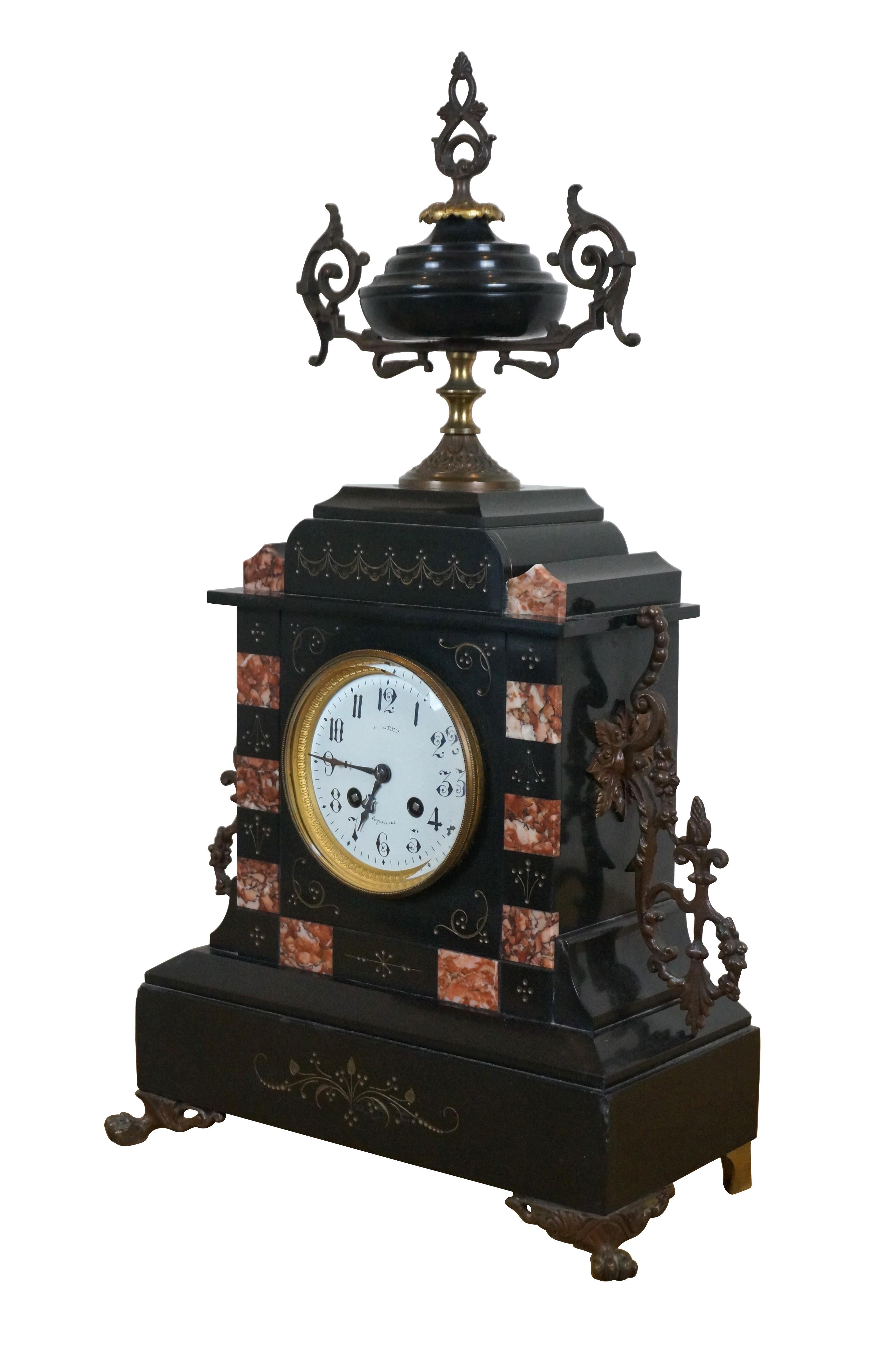 Late 19th Century L. Marti et Cie French Napoleon III style Mantel Clock & Garniture Set.  The beautifully designed lcock is made from slate with filigree engraving, reuge marble panels, ornate bronze detail and a trophy urn.  The face is enameled