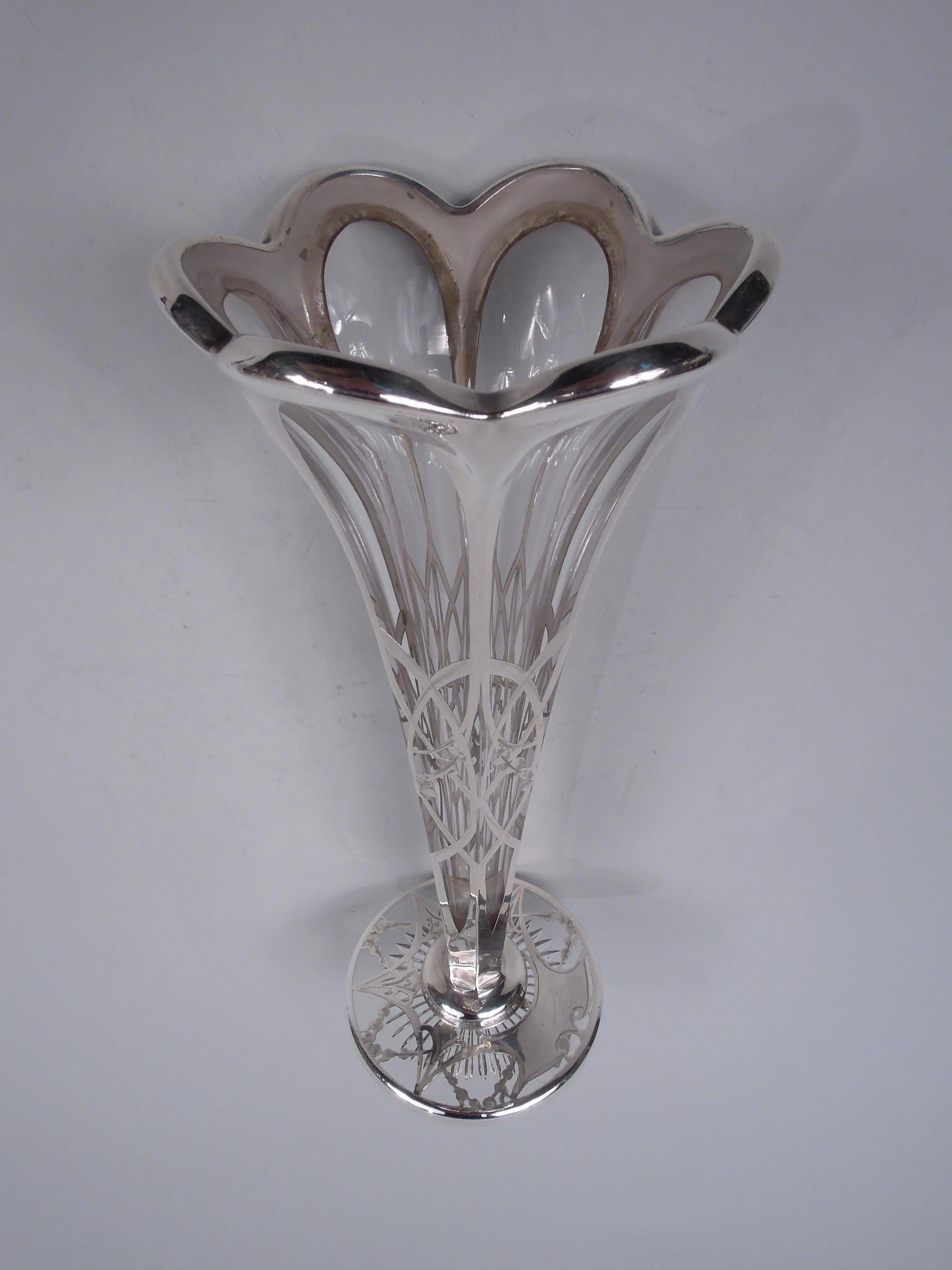 Edwardian Classical glass vase with engraved silver overlay. Made by La Pierre Mfg. Co. in Newark, ca 1910. Faceted cone with scalloped rim; round flat foot with star cut to underside. Overlay in form of garlands threaded through interlaced arches