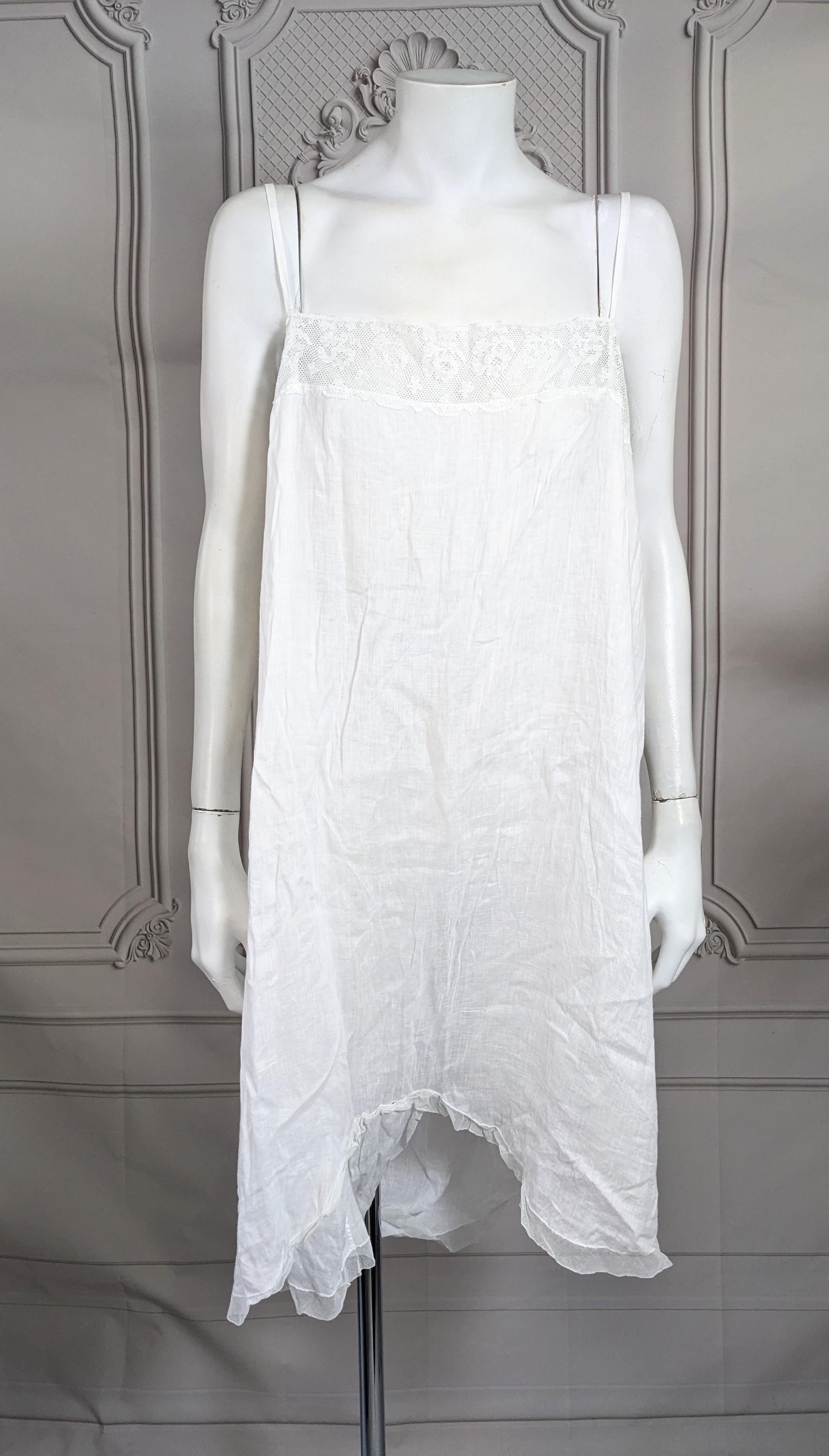 Pretty Antique Lace Trimmed Cotton Bastiste Teddy-Romper from the 1920's. Simple tubular cut which one steps into to enter with no closures or openings. Super fine sheer cotton batiste with wide lace trim and panel from back which creates leg