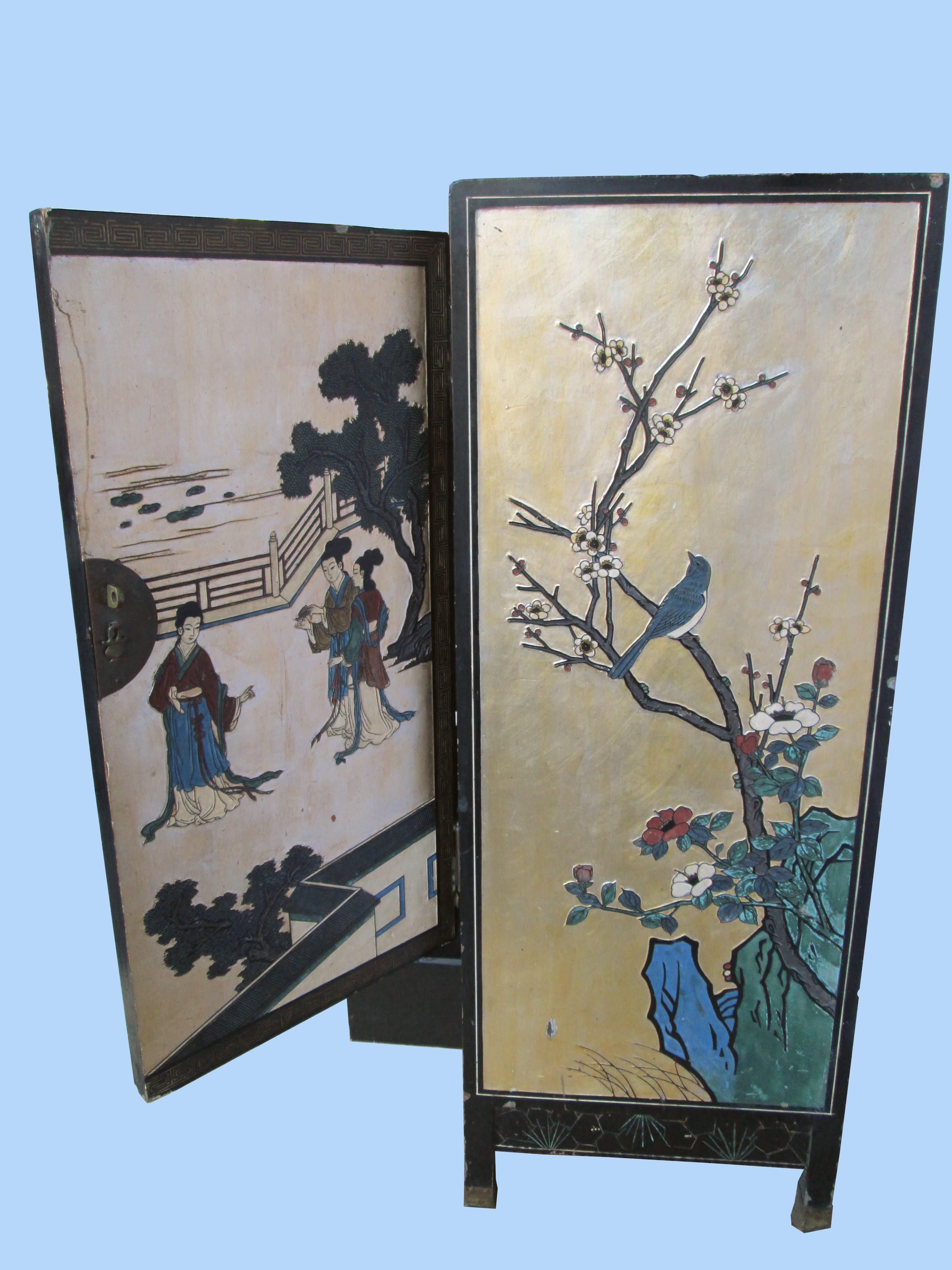 The handcrafting, gilt painting and sculptural elements make this cabinet somewhat breathtaking in different lights. The kimono-clad figures are graceful and the gold background palette set in a garden creates a tranquil and elegant scene. The