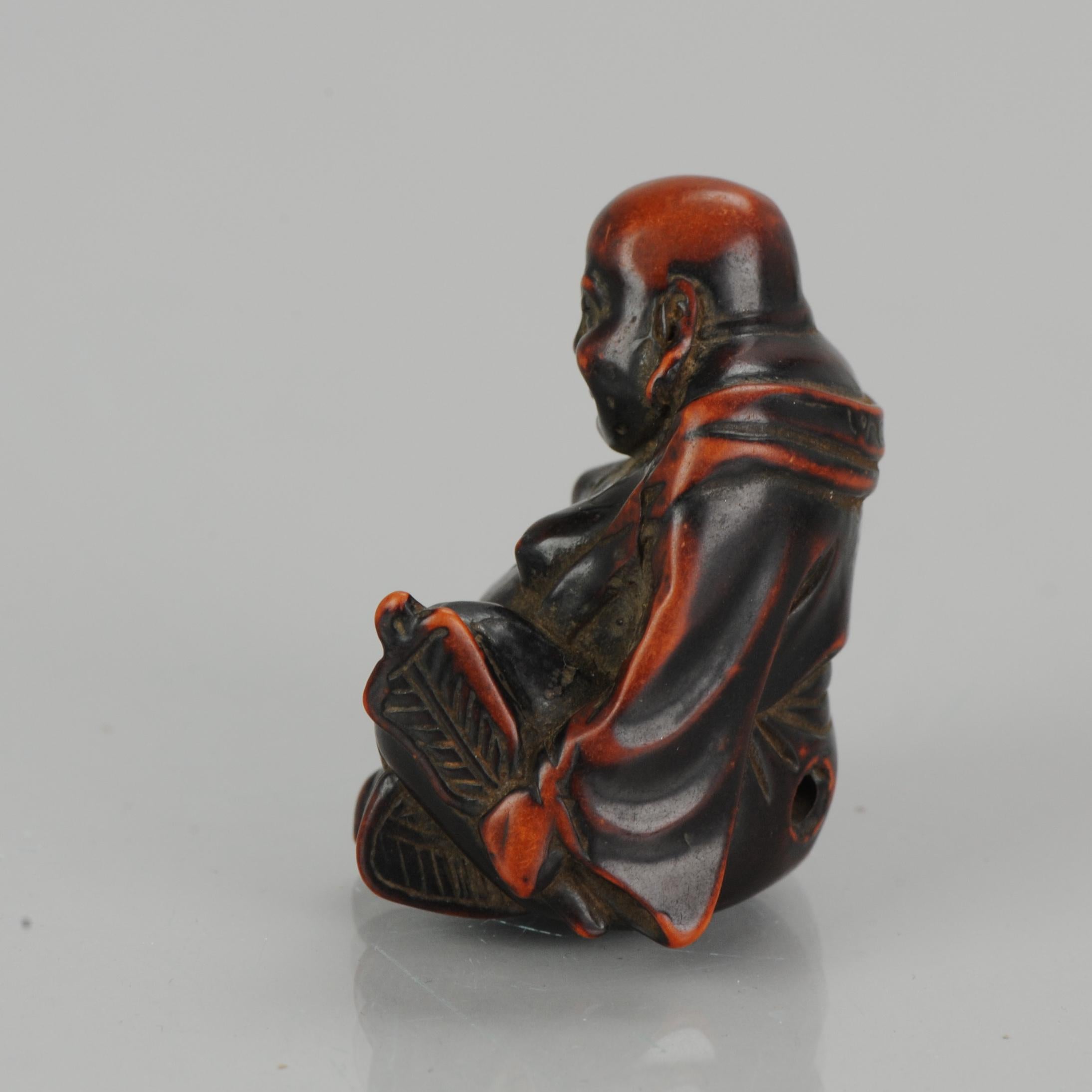 Antique Lacquer or Ceramic Netsuke Hotei with Fan 19th Century, Japanese, Japan In Excellent Condition In Amsterdam, Noord Holland