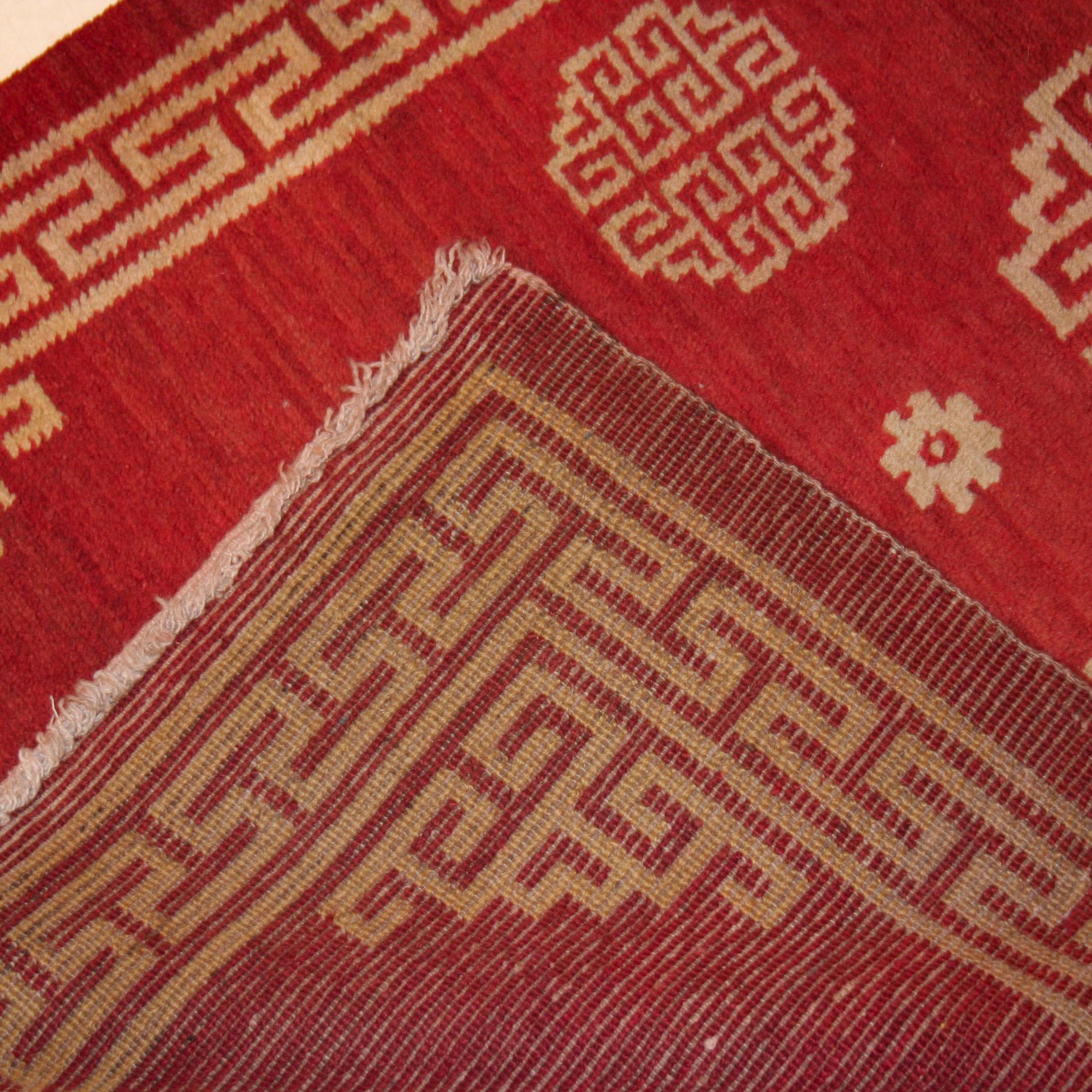 Hand-Knotted Antique Lacquer Red Tibetan Rug with Geometric Design For Sale