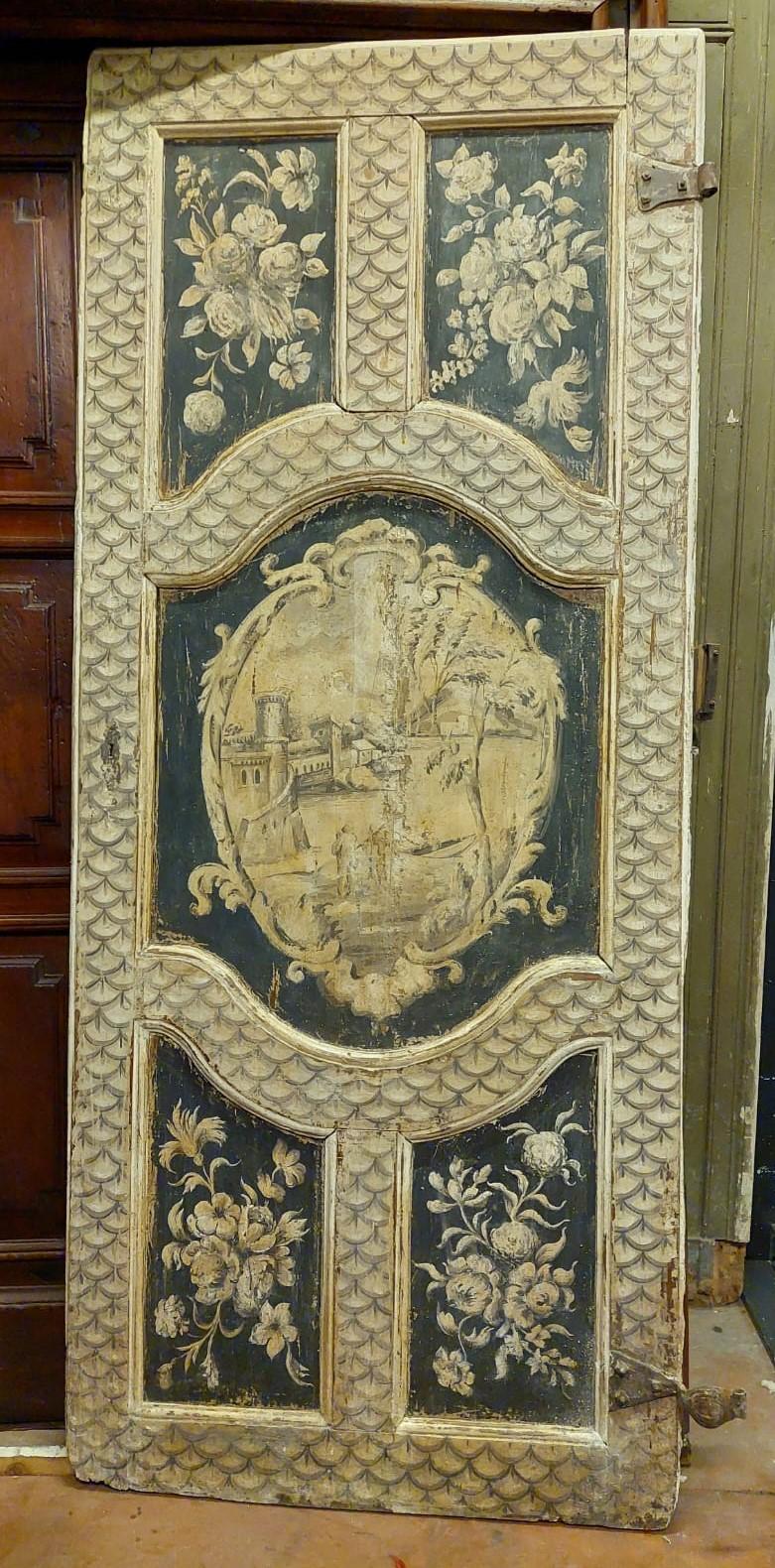 Antique lacquered and painted door, with panels carved with typical 18th century motifs, built by hand and painted by a craftsman of the time, for a noble palace in Florence (Italy).
It still has original irons, lacquered and painted also on the