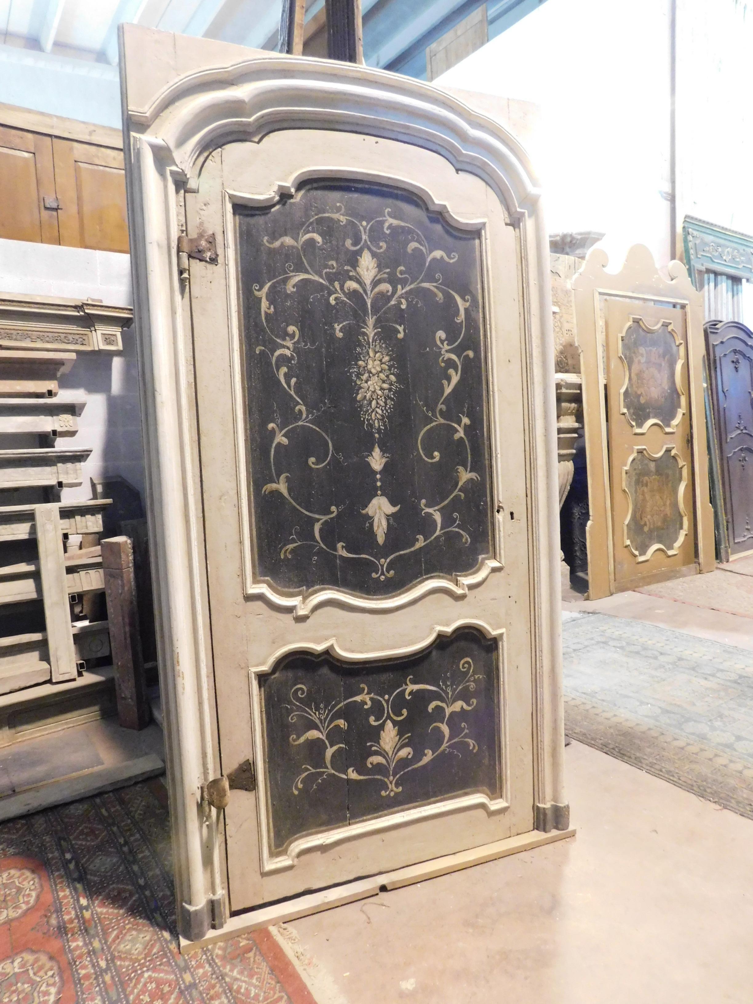 Ancient lacquered door with one leaf, with rich painted panels, complete with original wavy frame, from Piedmont (Italy), built in the middle of the 18th century, with gooseneck iron, typical of the time that allows bias opening, irons original and