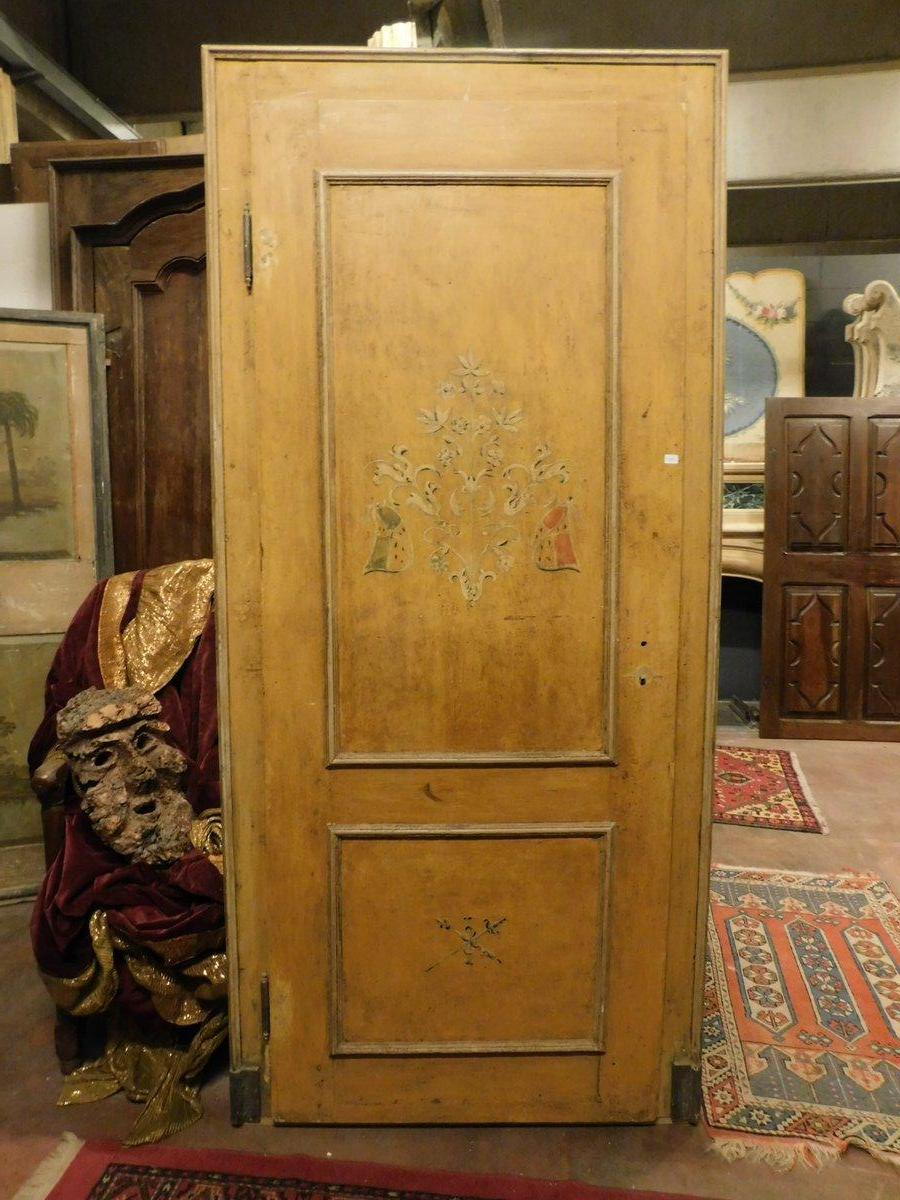 Antique lacquered and hand painted door, yellow background and molure with original frame and panels with painted noble symbols. Built in the 19th century for a home in Italy, in excellent state of conservation, it opens by pulling with hinges on