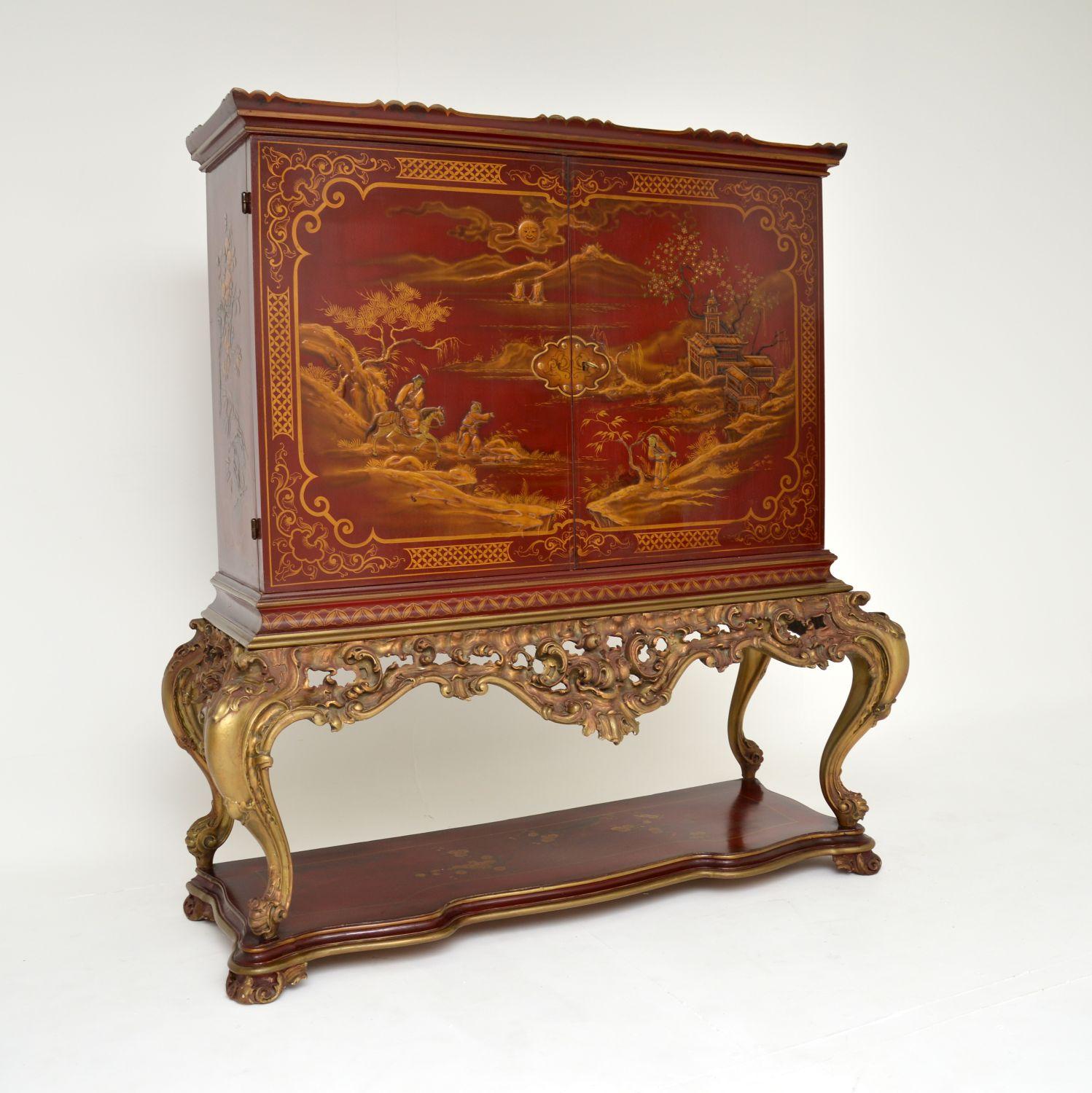 A magnificent antique Louis XV style lacquered chinoiserie cocktail drinks cabinet. This was made in England, it dates from around the 1930’s.

This is a most impressive piece of extremely high quality. It sits on an exquisitely carved base with a