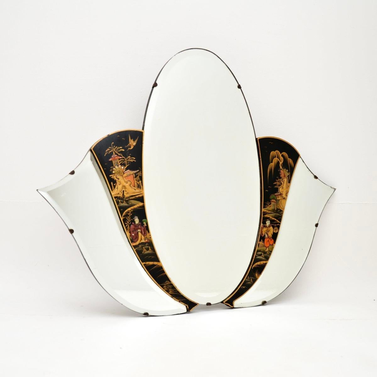 A beautiful antique lacquered chinoiserie mirror in the oriental style. This was made in England, it dates from the 1920’s.

It is of superb quality and is a lovely size, with a beautiful design. The glass has bevelled edges, and this has two