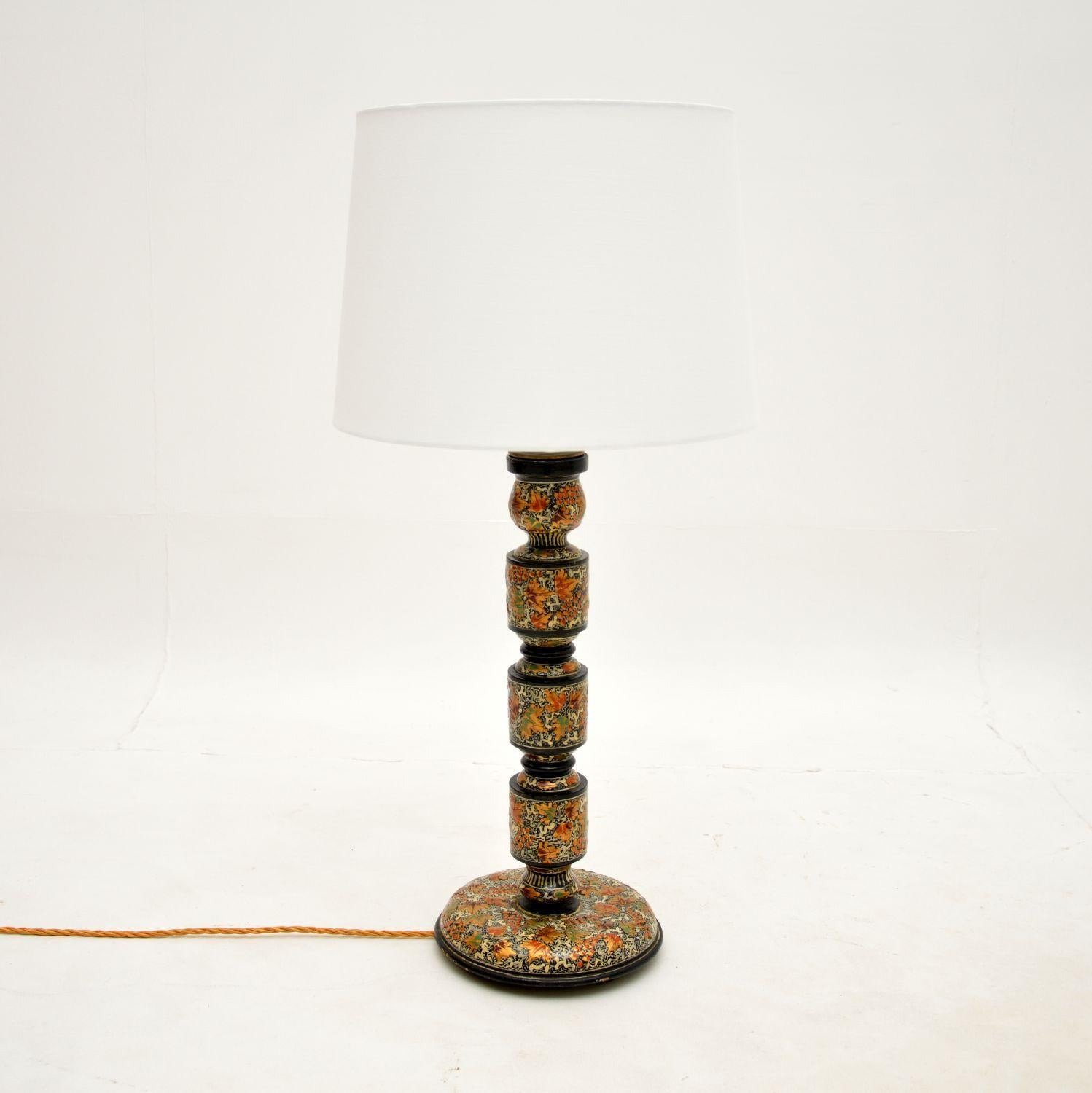 A stunning and quite unusual antique lacquered chinoiserie table lamp. This was most likely made in England, it dates from around the 1920’s.

It has absolutely gorgeous hand painted and lacquered decorations, with beautiful colours and patterns.