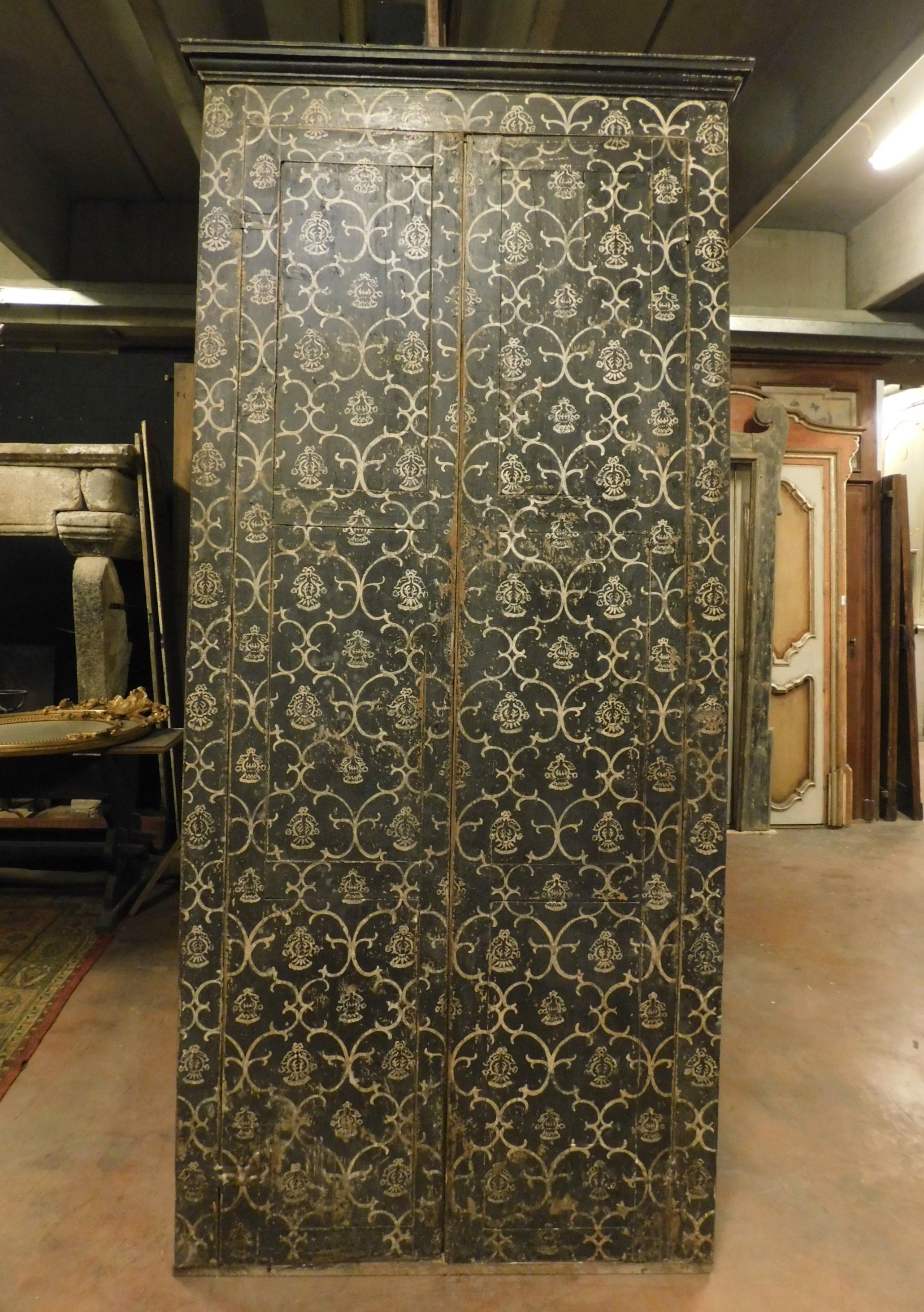 Antique cabinet or wall placard for wardrobe, lacquered and hand painted, black background with white texture, has two doors inside and frame with hat, usable both as a door with pull opening and as a built-in wardrobe. handmade in the 19th century,