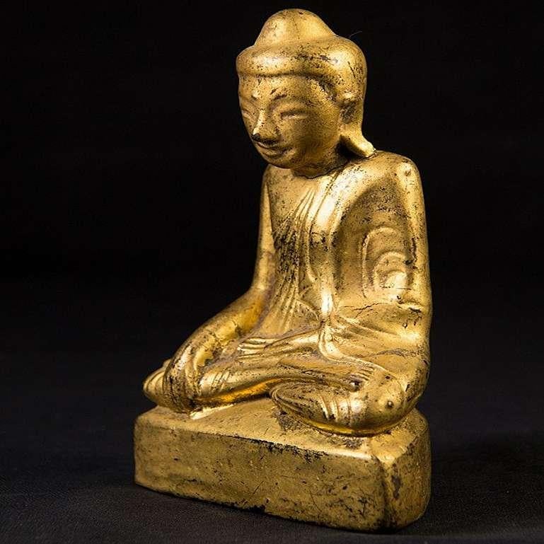 Material: lacquerware
13,5 cm high 
8 cm wide and 4 cm deep
Weight: 0.098 kgs
Gilded with 24 krt. gold
Shan (Tai Yai) style
Bhumisparsha mudra
Originating from Burma
19th century
With inscriptions in the base.
 