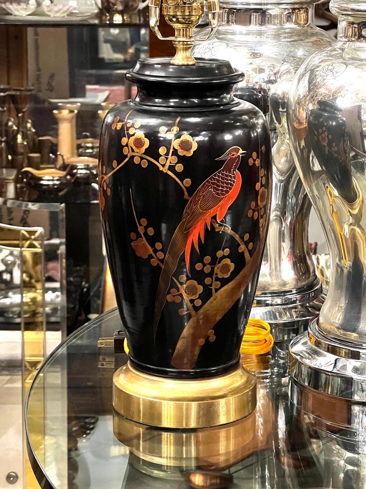 A circa 1920s Japanese lacquered table lamp with gilt details.

Measurements:
Height of body: 13