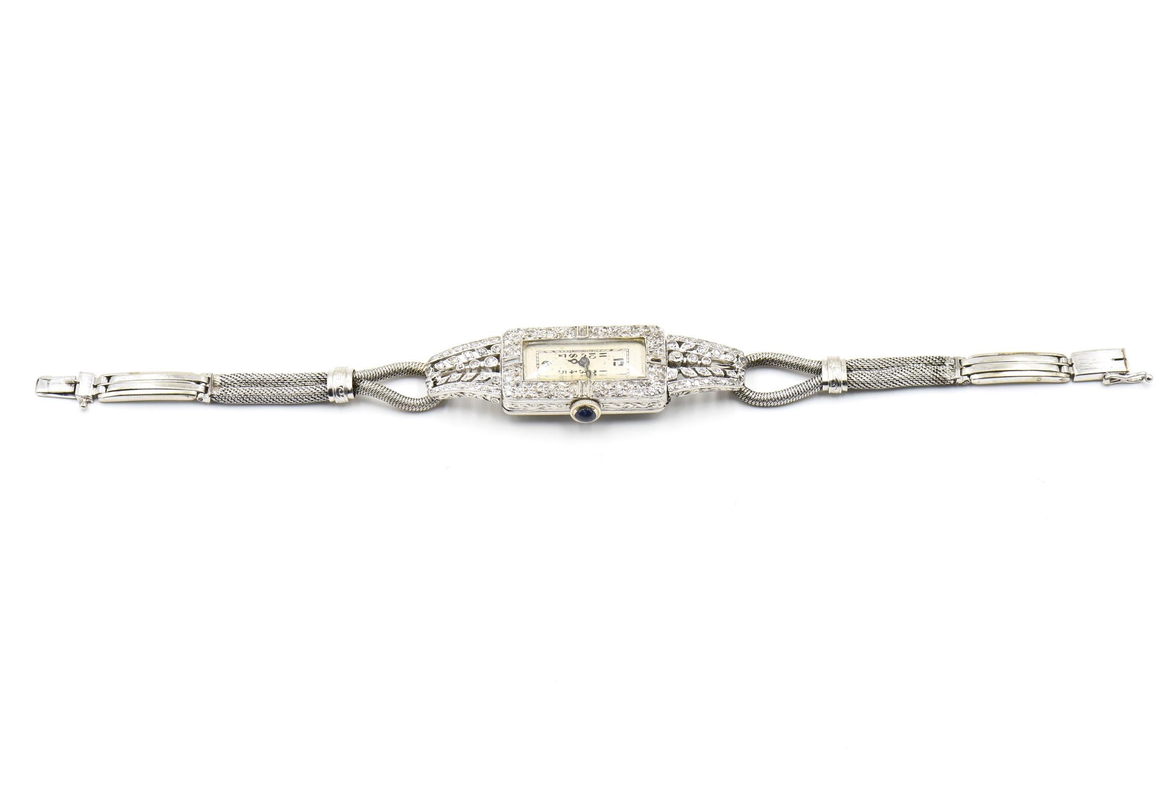 Montre-bracelet ancienne pour dames à diamant allongé en platine et or Pour femmes en vente