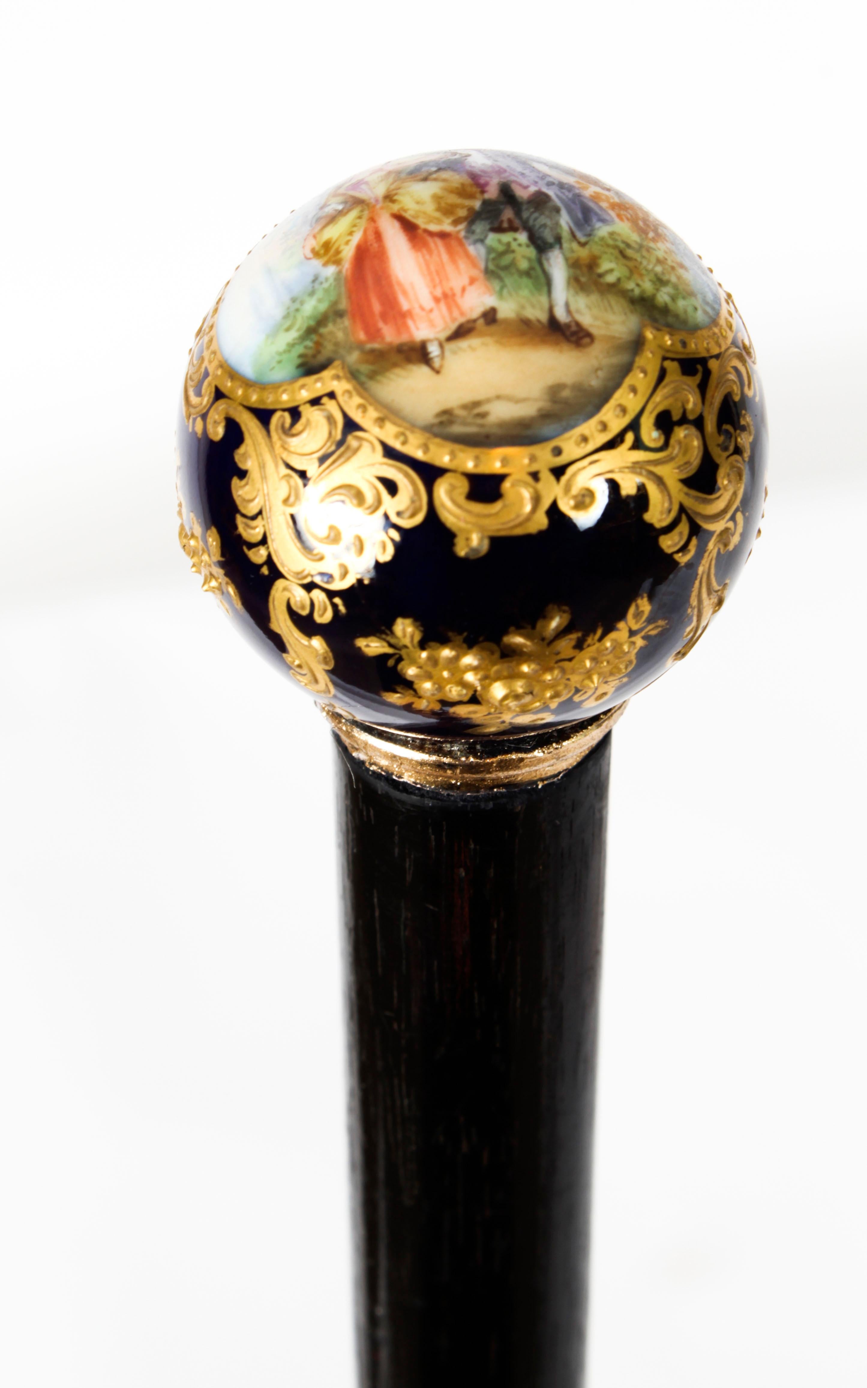 This is a beautiful walking cane with hand painted porcelain spherical handle in the Sevres manner, with an ebonised shaft, Circa 1880 in date.
 
The handle is beautifully decorated with a quatrefoil vignette of a courting couple within a garden,