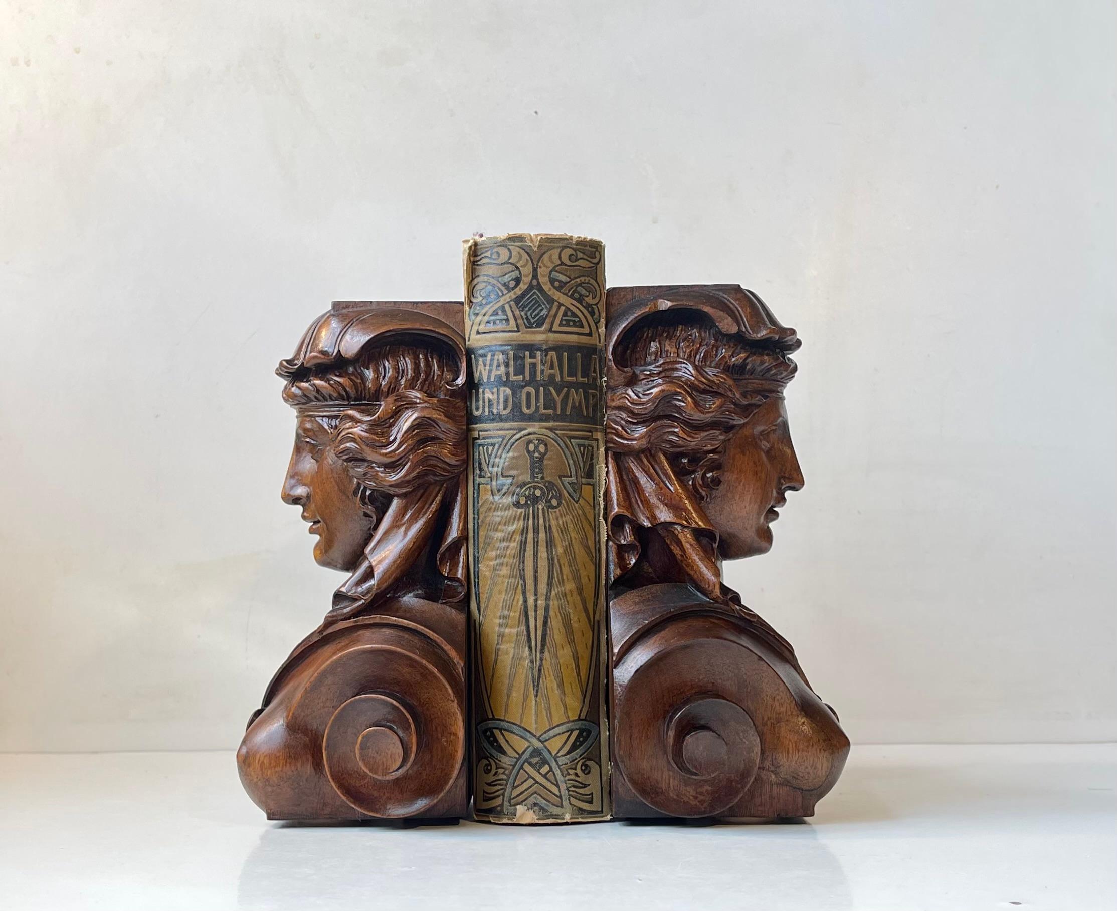 A set of exceptionally well-made mahogany bookends depicting bare-breasted Venus or Libertas in Eugene Delacroix’s masterpiece: 'France Sees Liberty'. It does not take much to see that these were made to a special client. Just take a look at the