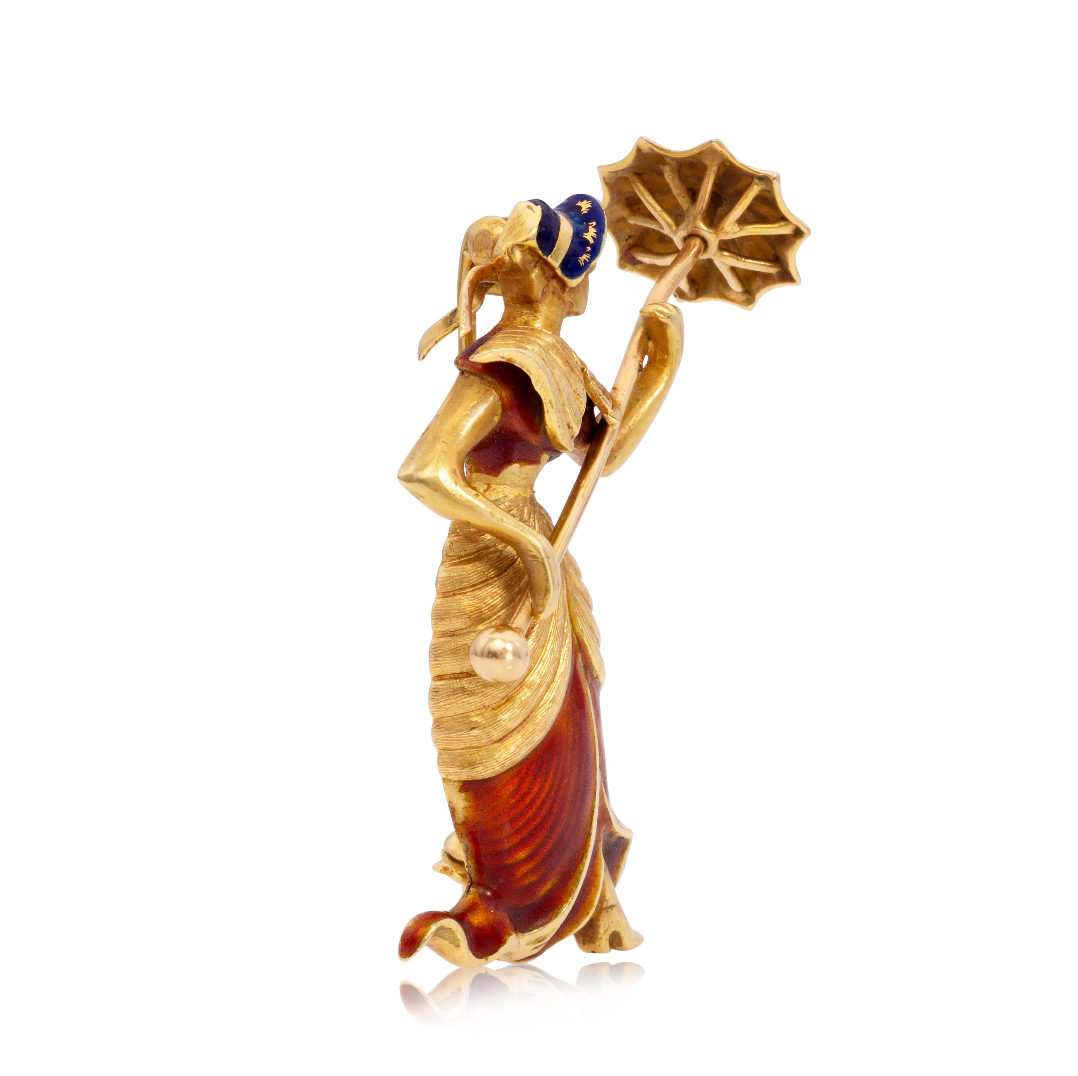 An antique brooch, featuring a lady with an umbrella. Finely made with 18K yellow gold and enamel. The Perfect accessory. 
