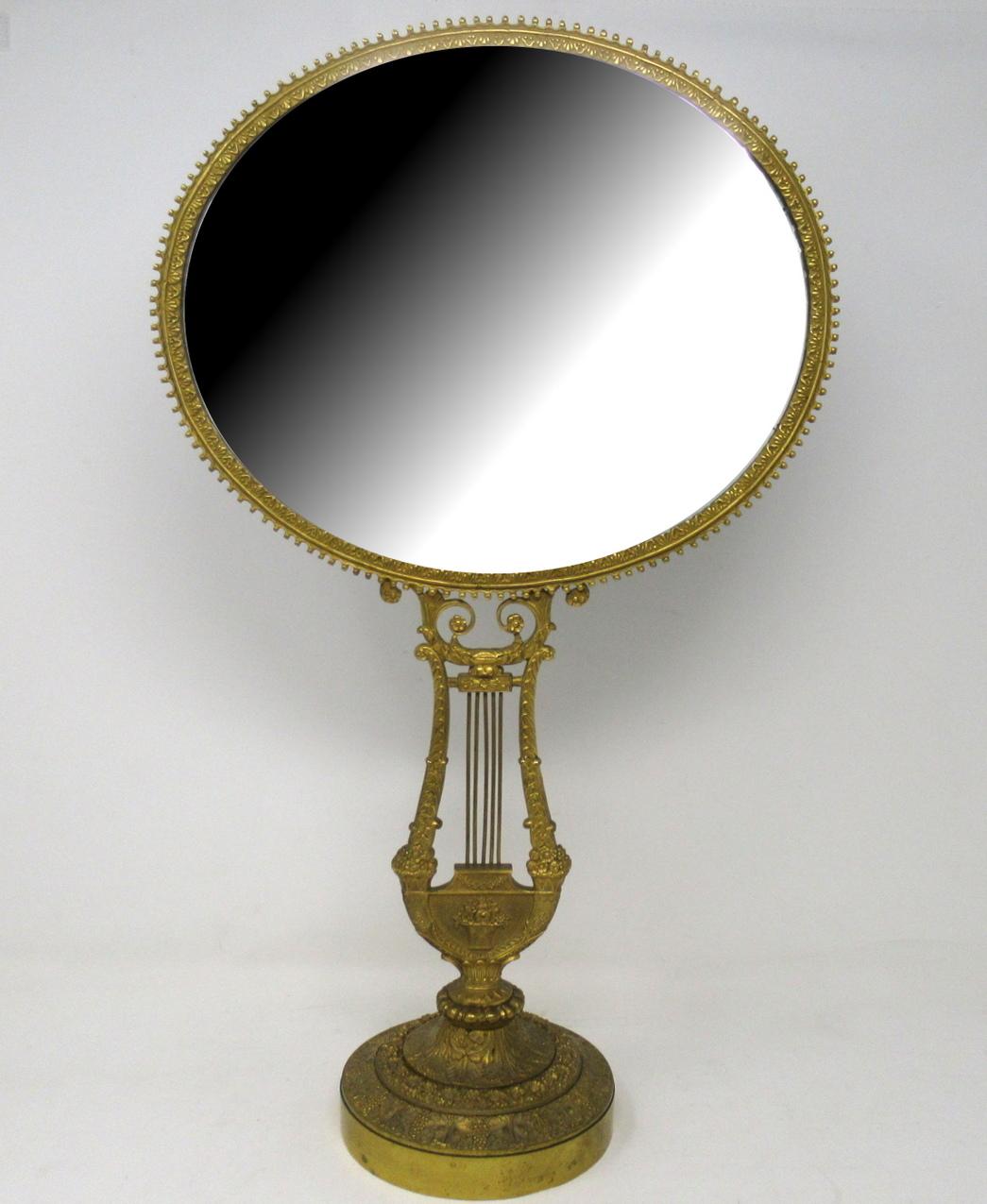Stunning rare lady's superbly cast French Ormolu dressing table mirror of outstanding exhibition quality and generous size, made during the early part of the 19th century. 

The oval form looking glass within a beaded and leaf cast frame above a