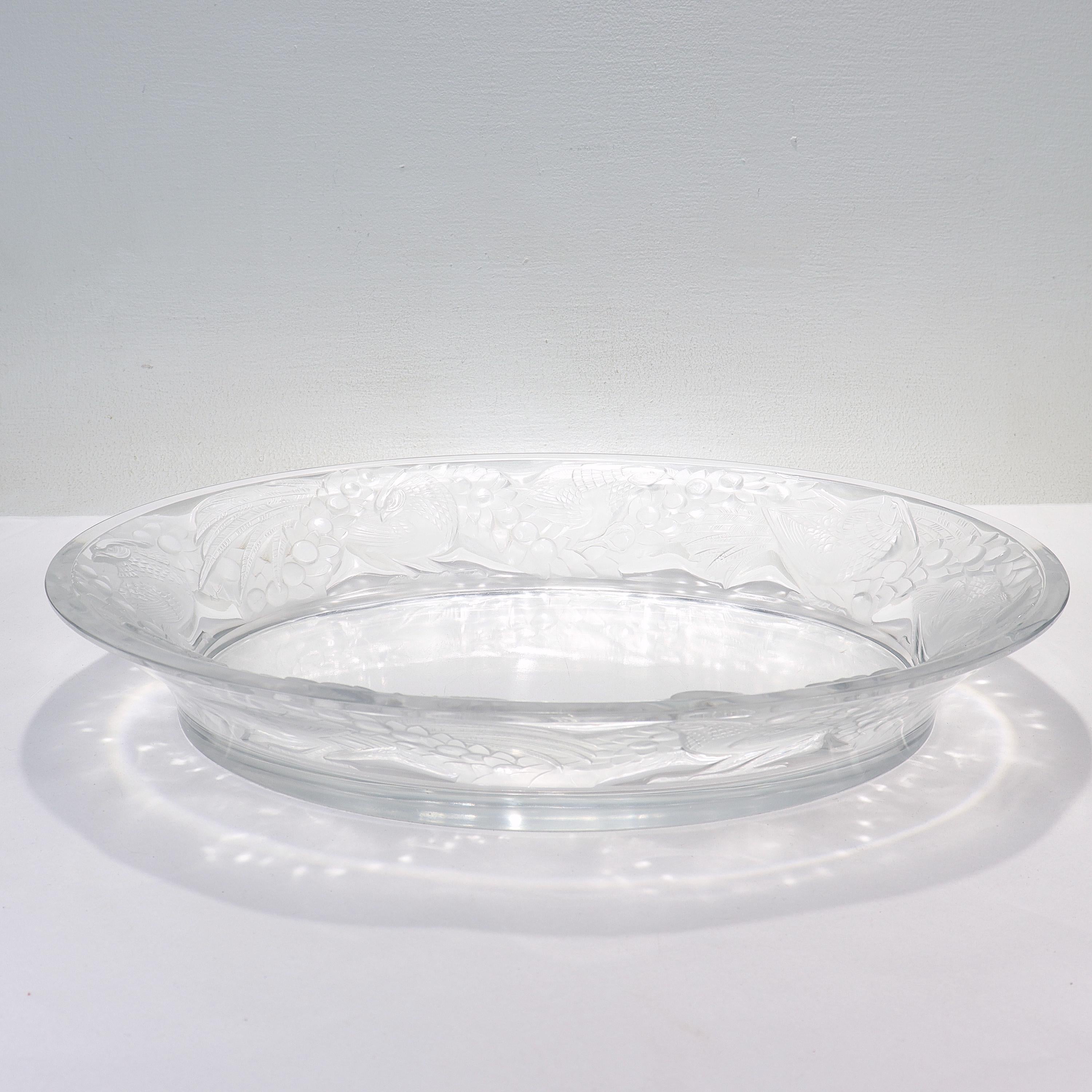 A fine antique art glass bowl.

By Lalique.

In the 'Faisans' pattern. 

With a wide rim decorated with molded pheasants amidst berries and foliage.

Simply a wonderful Lalique art glass bowl!

Date:
20th Century

Overall Condition:
It
