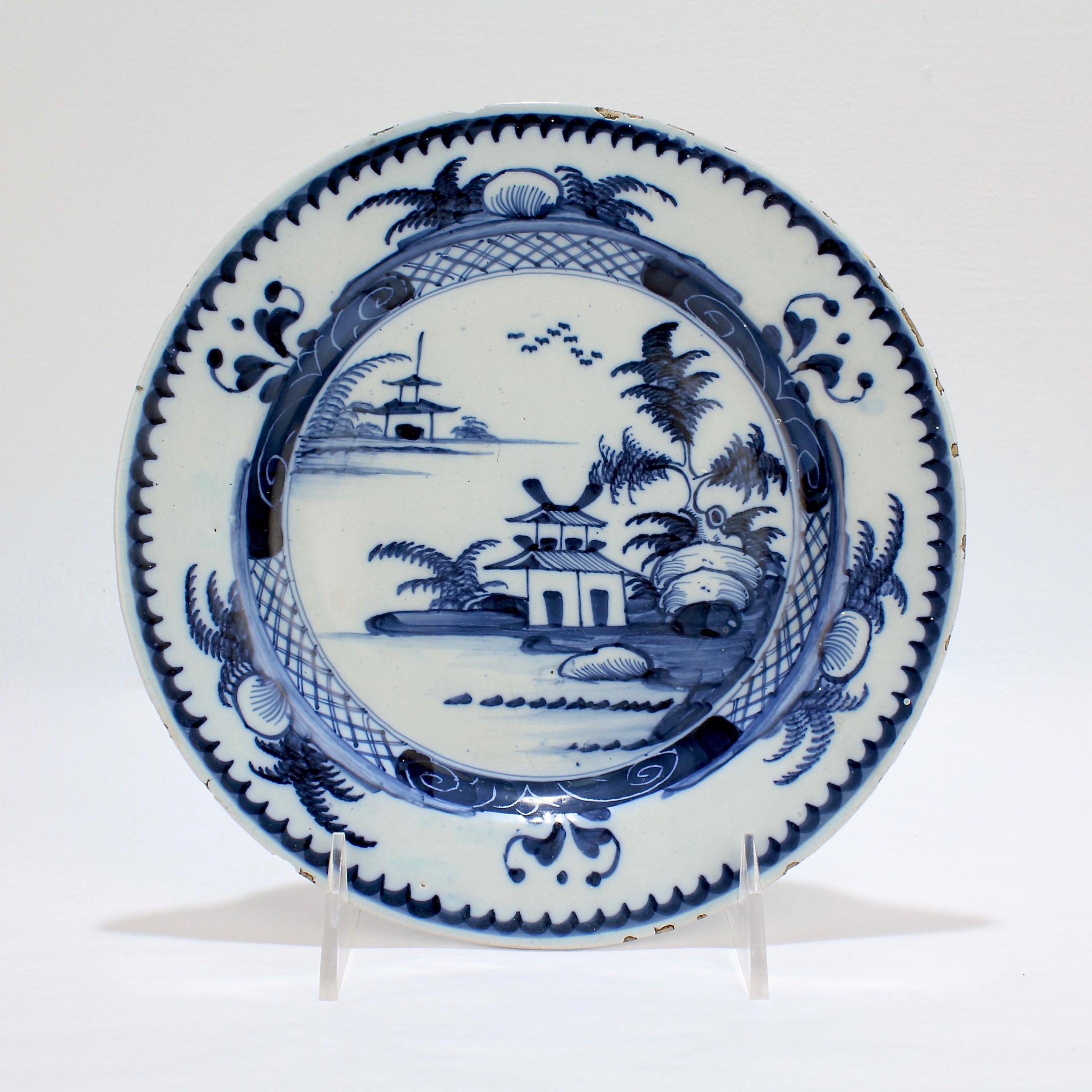 A good, antique English delft plate.

Likely Lambeth with deep blue chinoiserie decoration and a sawtooth border.

A fine early example with strong color!

Measures: Diameter ca. 7 7/8 in.

Items purchased from this dealer must delight you.
