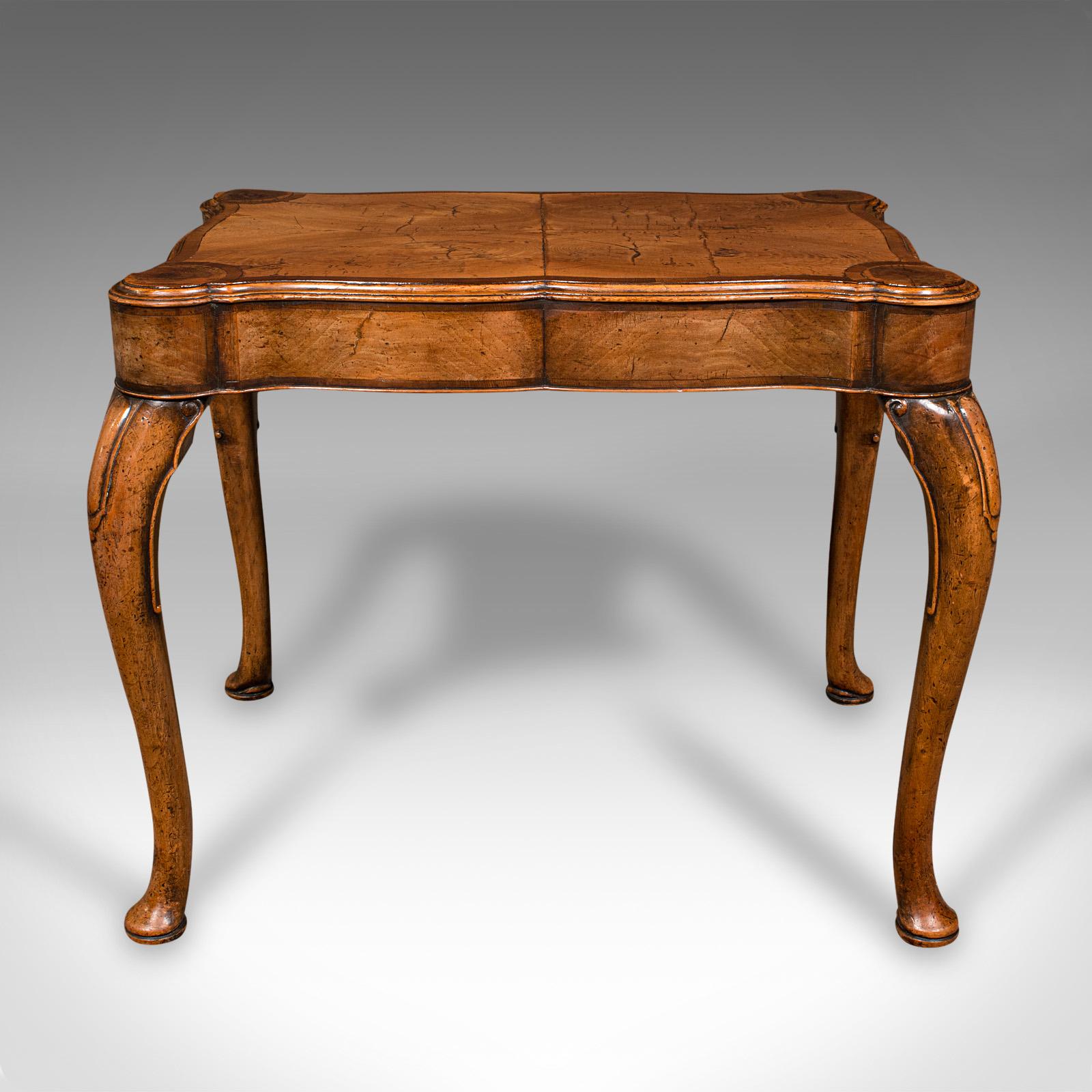 This is an antique quarterfoil lamp table. An English, walnut occasional table with Georgian revival taste, dating to the Art Deco period, circa 1920.

Delightfully crafted table with appealing form and finish
Displays a desirable aged patina and in