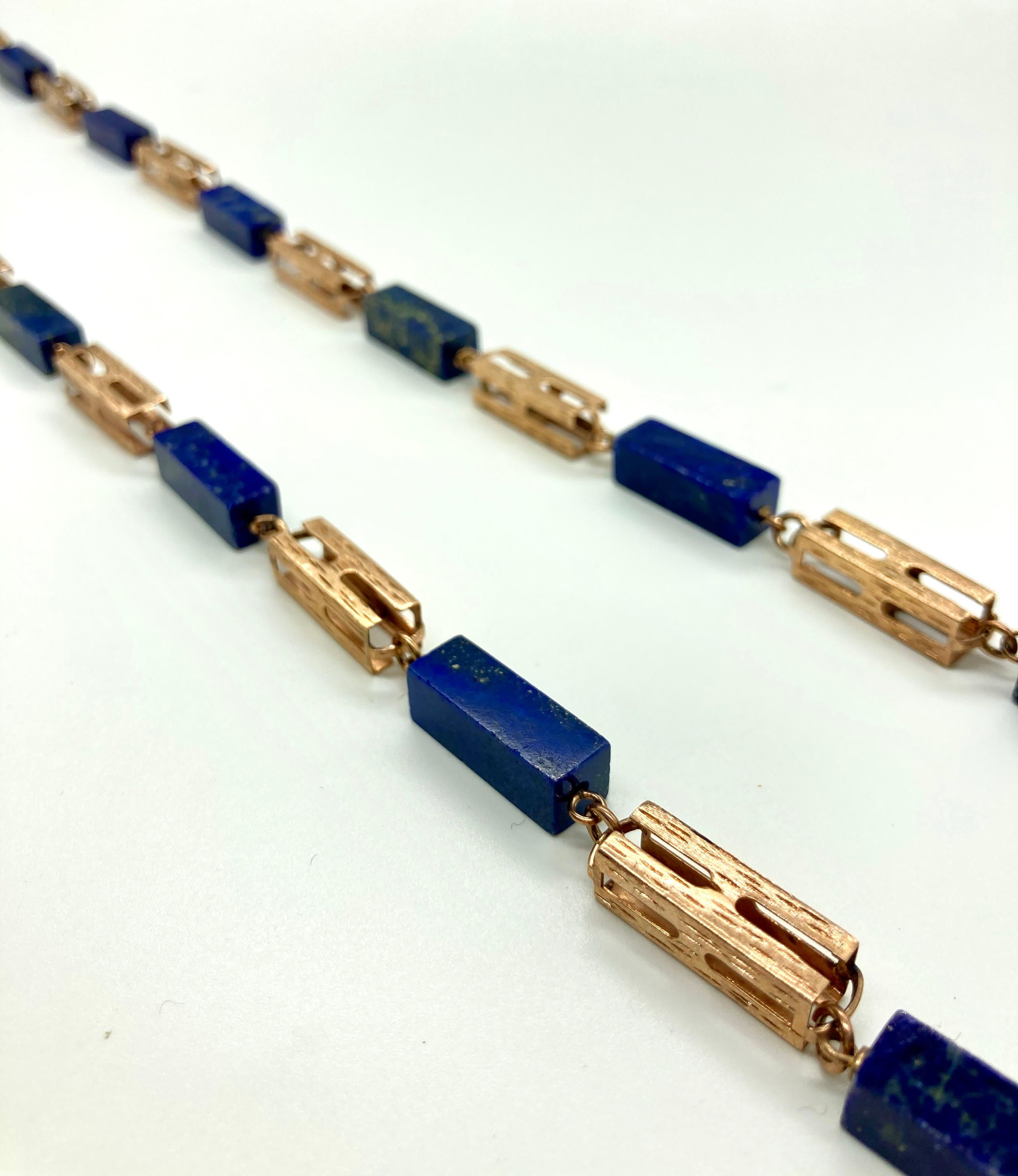 A beautiful antique nineteenth century long chain in 14 karat rose gold and lapis. Measures 40 inches long and weighs 96 grams.