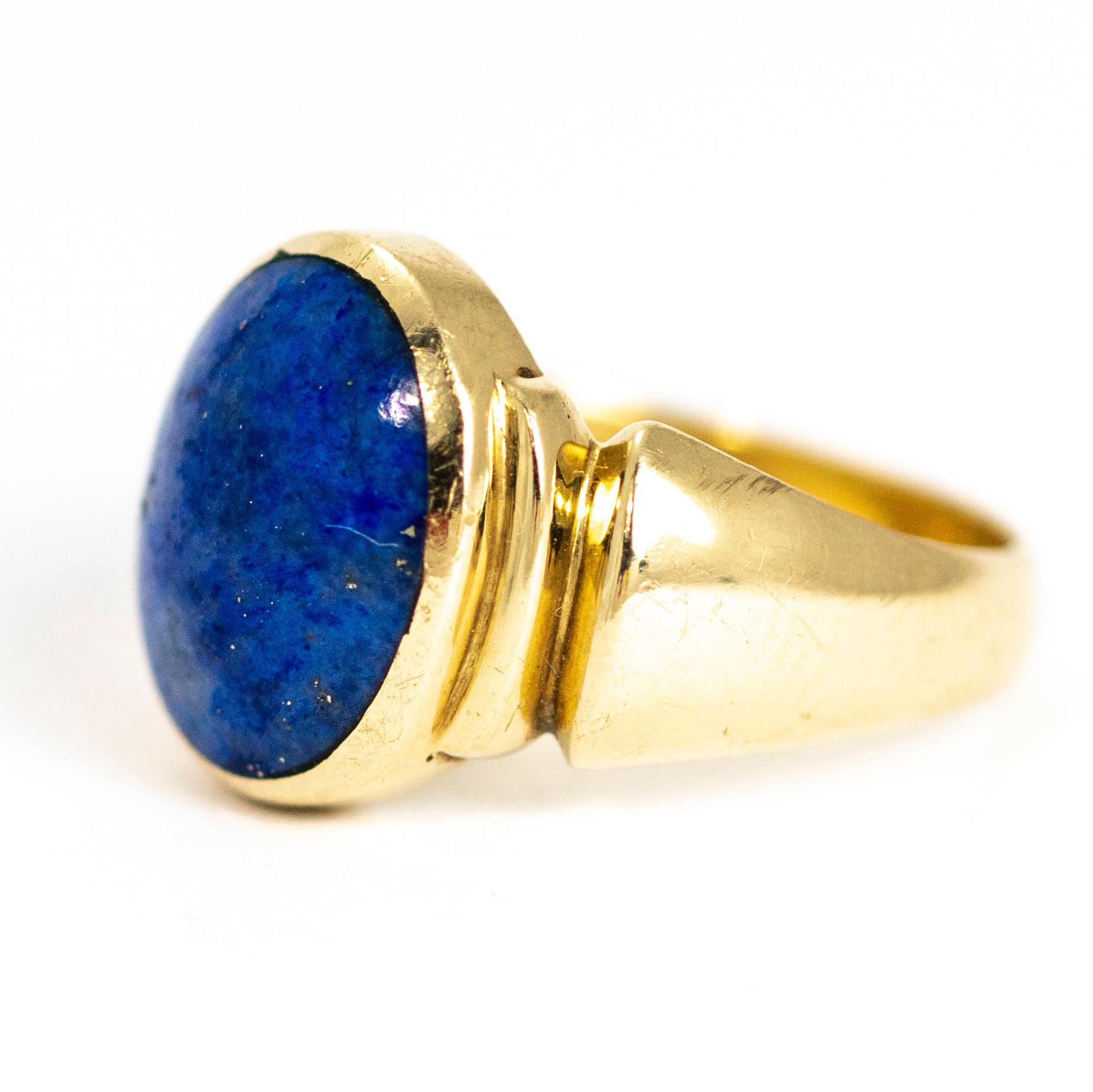 This antique signet ring was crafted in 1914. It is set with a beautiful large lapis lazuli cabochon between stunning stepped shoulders. Modelled in 9 carat yellow gold.

Fully hallmarked 1914 Sheffield, England

Ring Size: N or 6 3/4