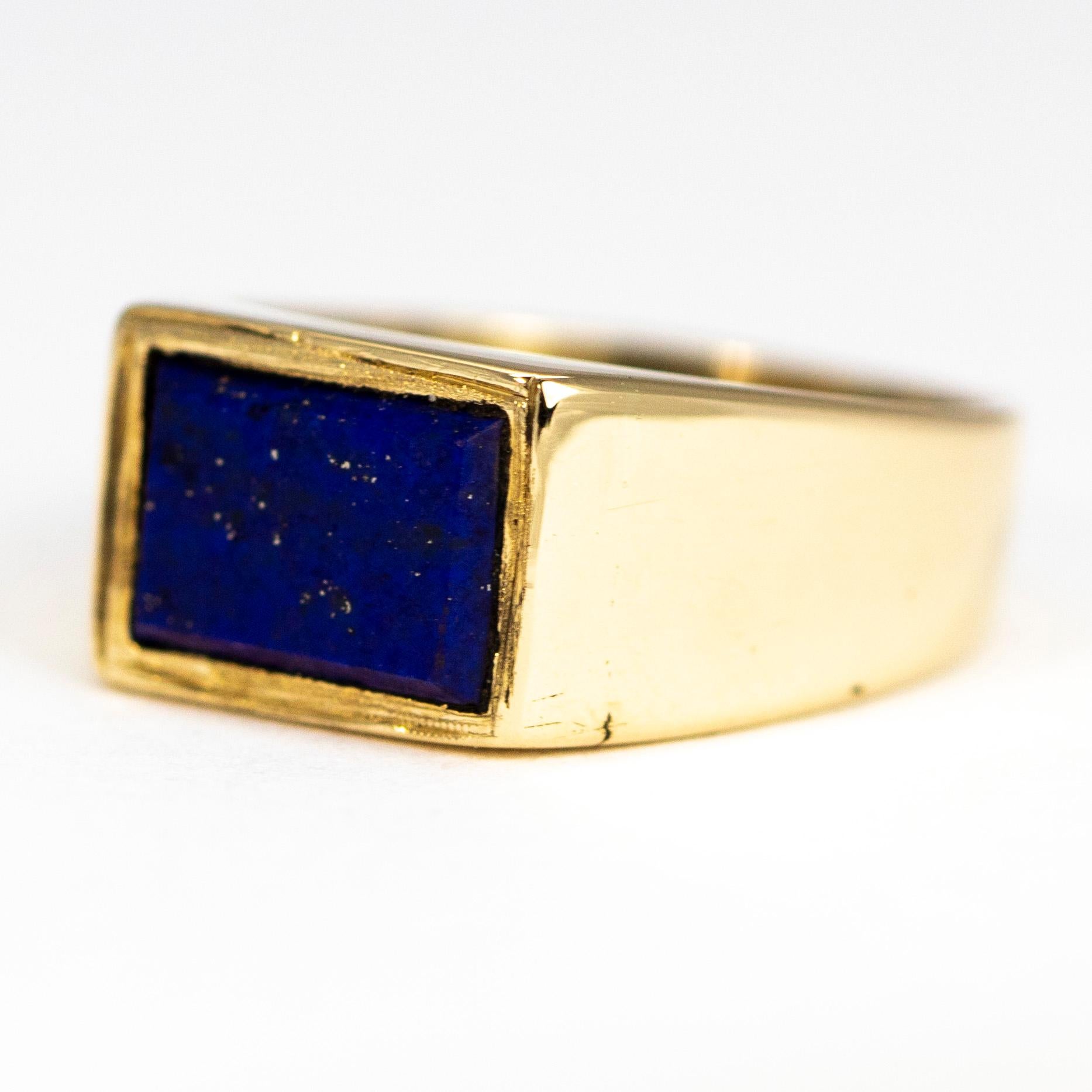 The main feature of this chunky angular signet ring is the bright blue lapis stone with wonderful gold flecks running through it. The stone is rectangular and is set flush within the 9ct gold band. 

Ring Size: H or 3 3/4
Stone Dimensions: 5.5 x 8mm